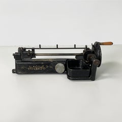English Table pencil sharpener in black cast iron by Guhl&Harbeck, early 1900s