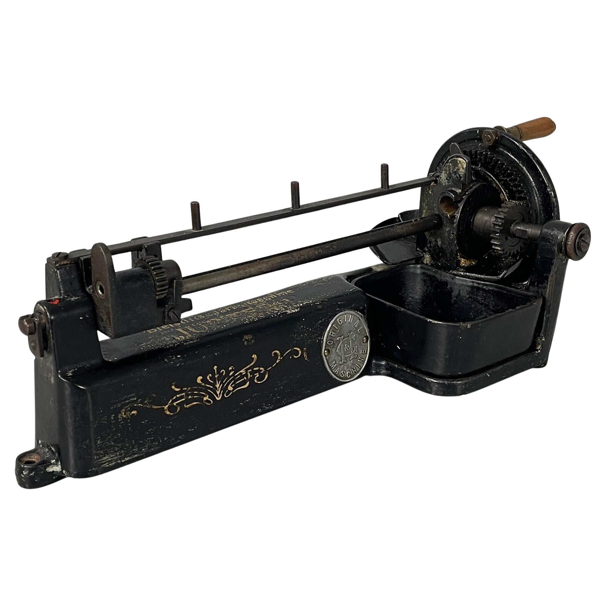 English Table pencil sharpener in black cast iron by Guhl&Harbeck, early 1900s
