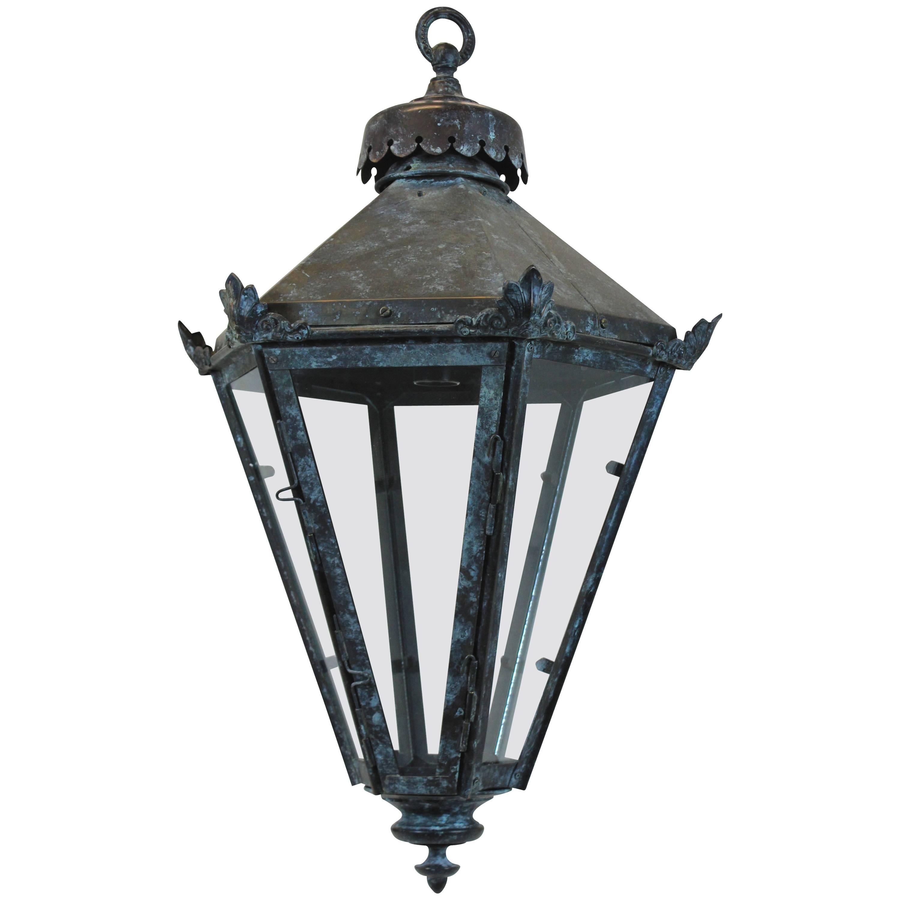 An English tapering copper lantern with good patina and covered glazed panels.

Subjected to VAT.