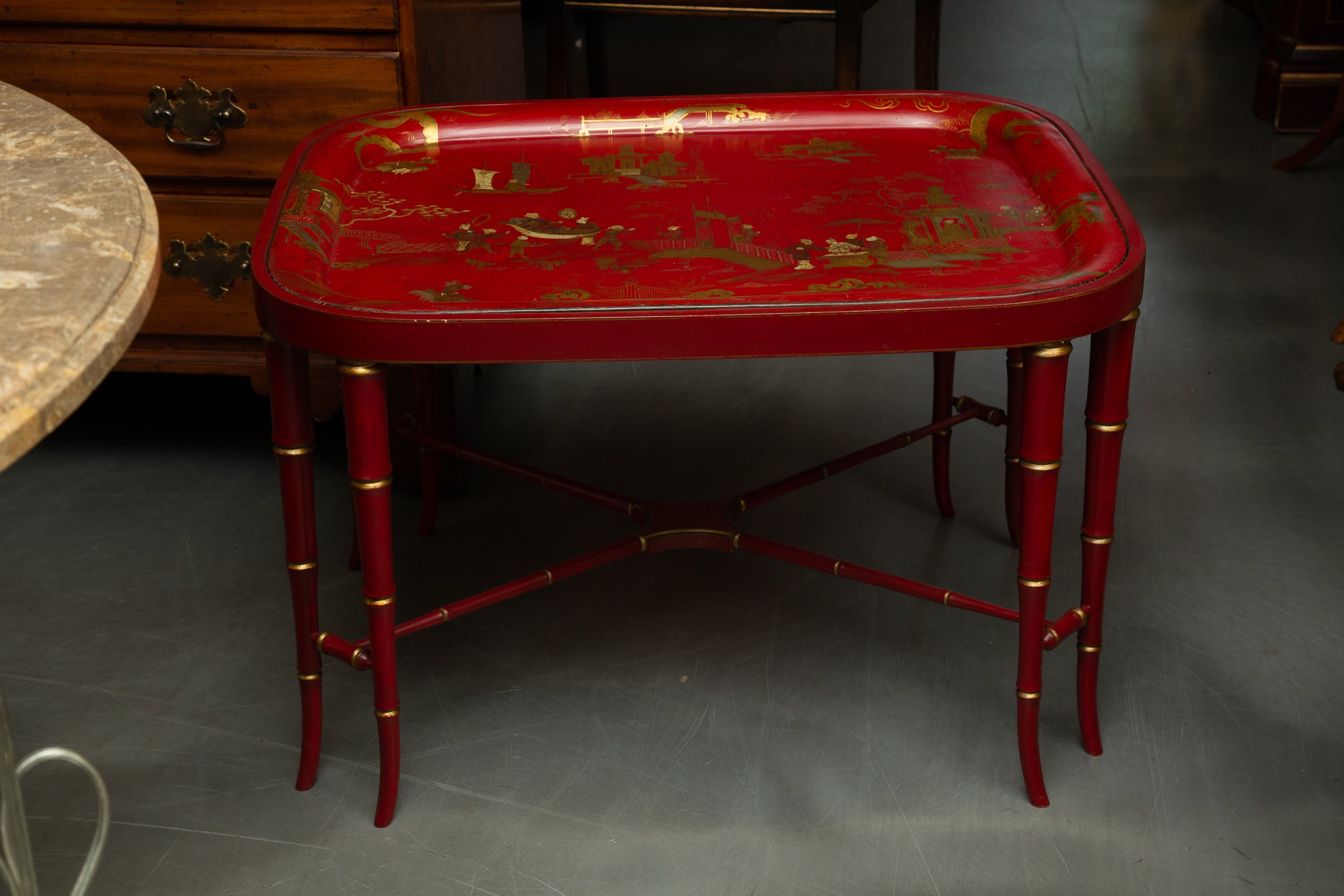 Pheromonal antique tomato red chinoiserie tray on a later painted tray.