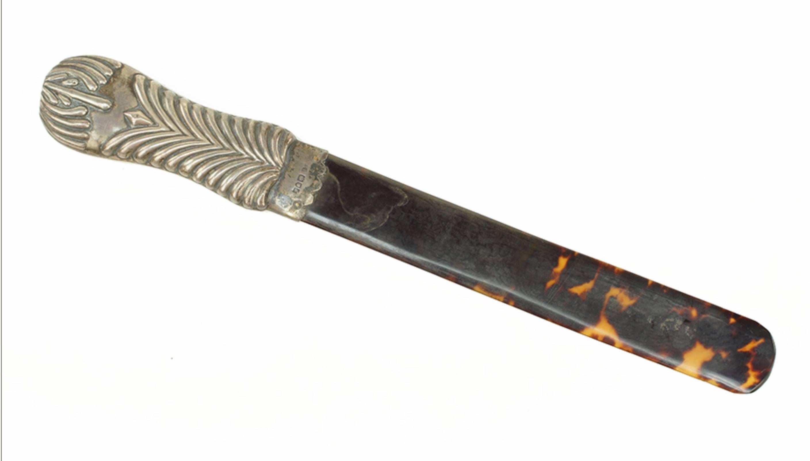 An English tortoiseshell and silver page turner
Tortoiseshell blade with an English repousse silver handle
Measures: Length 12.5
