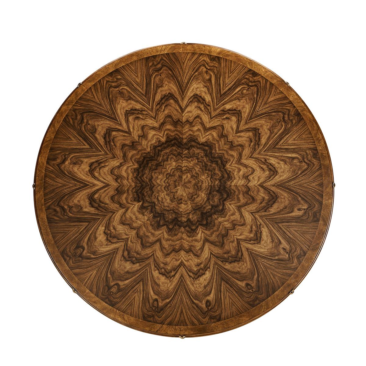 This exquisite Regency-style table combines historical charm with contemporary flair, making it a wonderful addition to any dining space.

Crafted with a radial veneer pattern, the table showcases a beautifully intricate wood grain that draws all