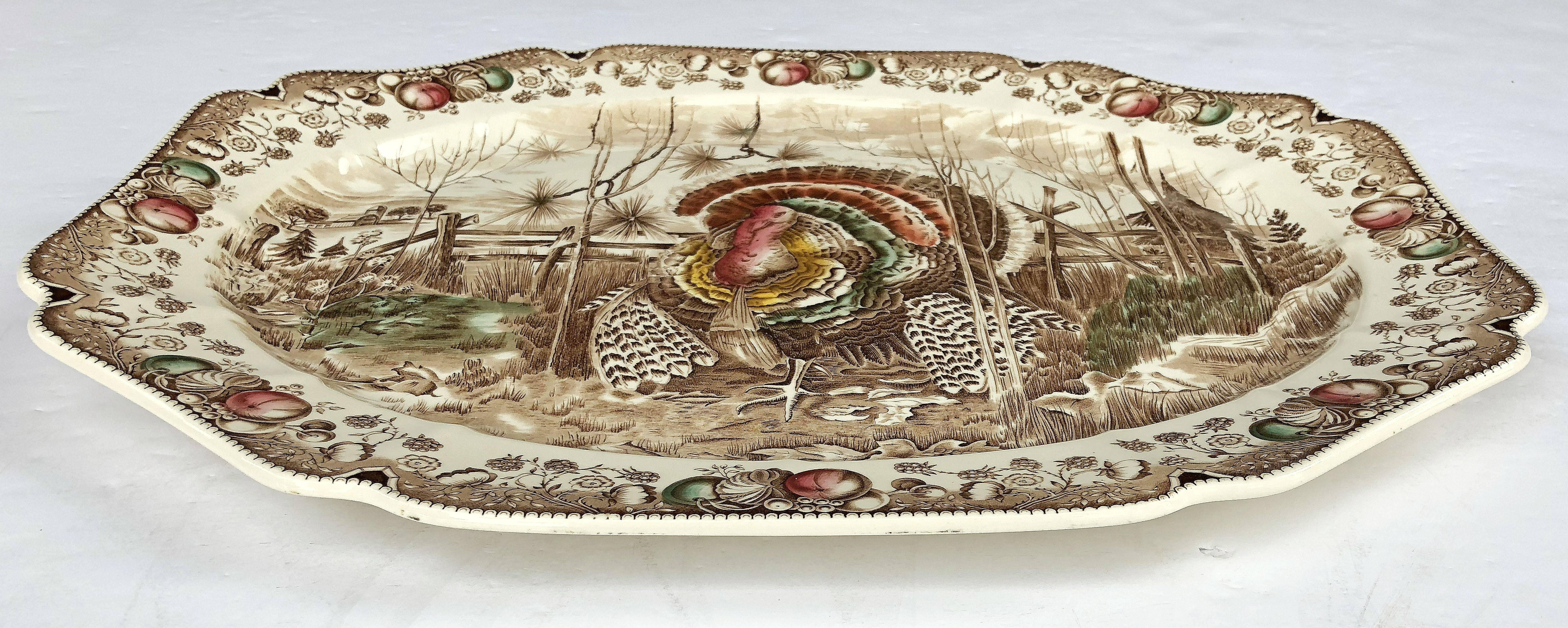 A large vintage serving platter featuring the Wild Turkey, his majesty brown and white transfer-ware pattern by the celebrated English pottery firm, Johnson Brothers.

With authentic midcentury brown label on reverse.

Perfect for the
