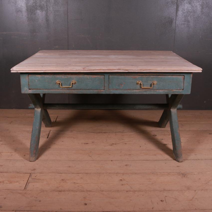 Unusual 19th century English four-drawer trestle table with old pine scrubbed top, 1860.

22