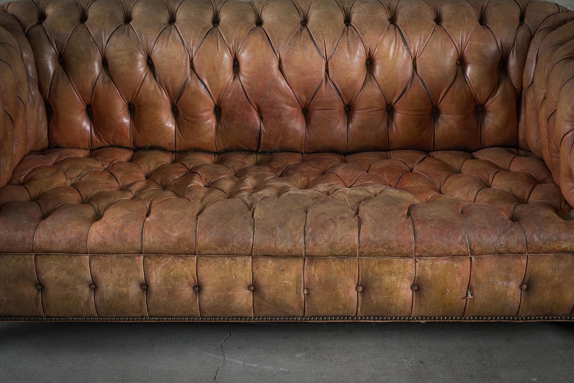 brown tufted sofa