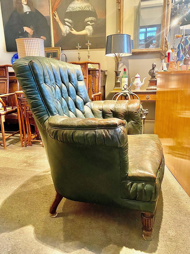 Nice Patina late Victorian English tufted green leather Library armchair.