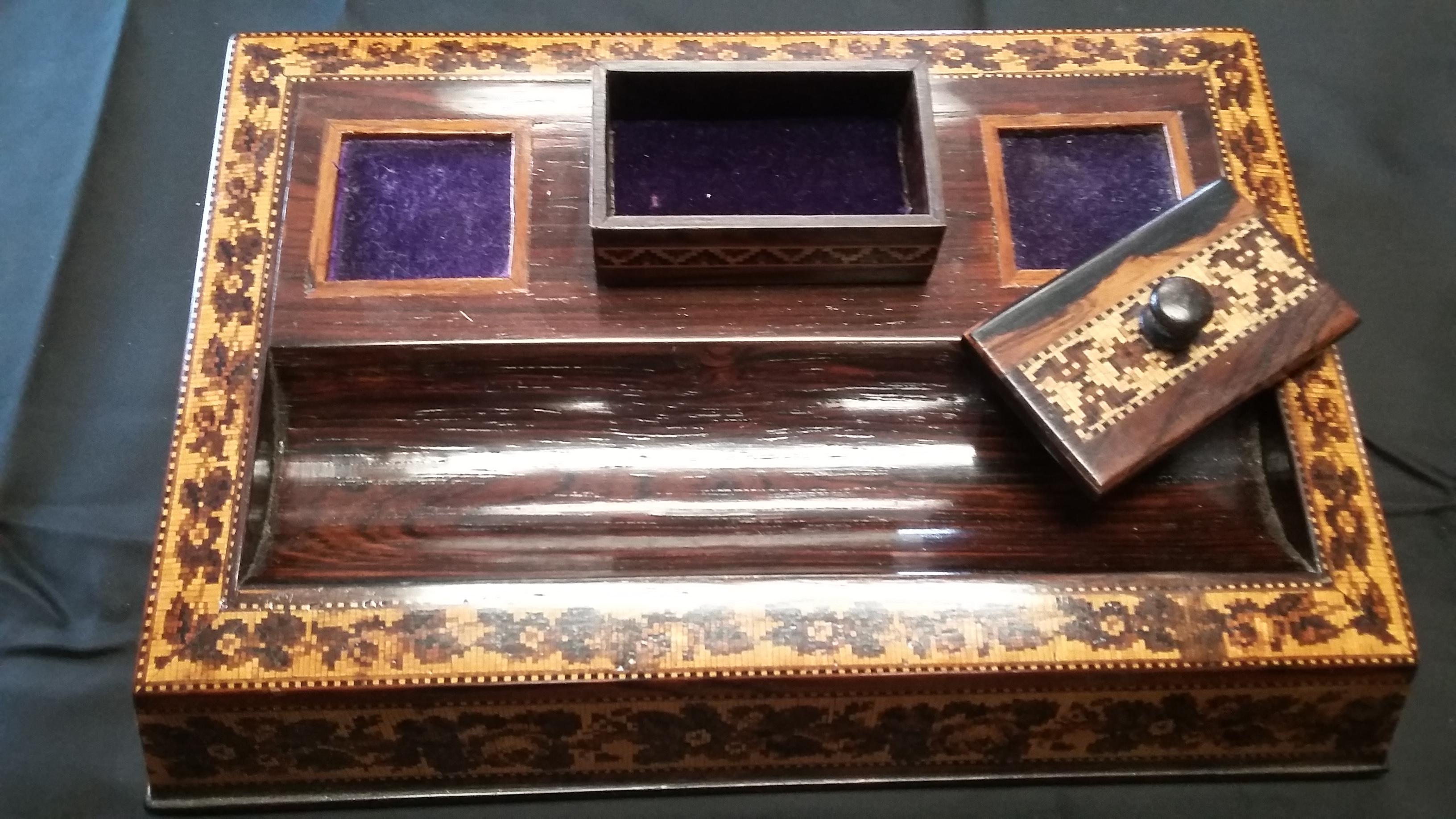 Beautiful English Tunbridgeware inkstand rosewood desk accessory. Very detailed inlays all around this piece. Made in England, circa 1870. Has a place for 2 inkwells (missing), slotted areas for pen(s) and a lidded box for wax. Tunbridgeware is a