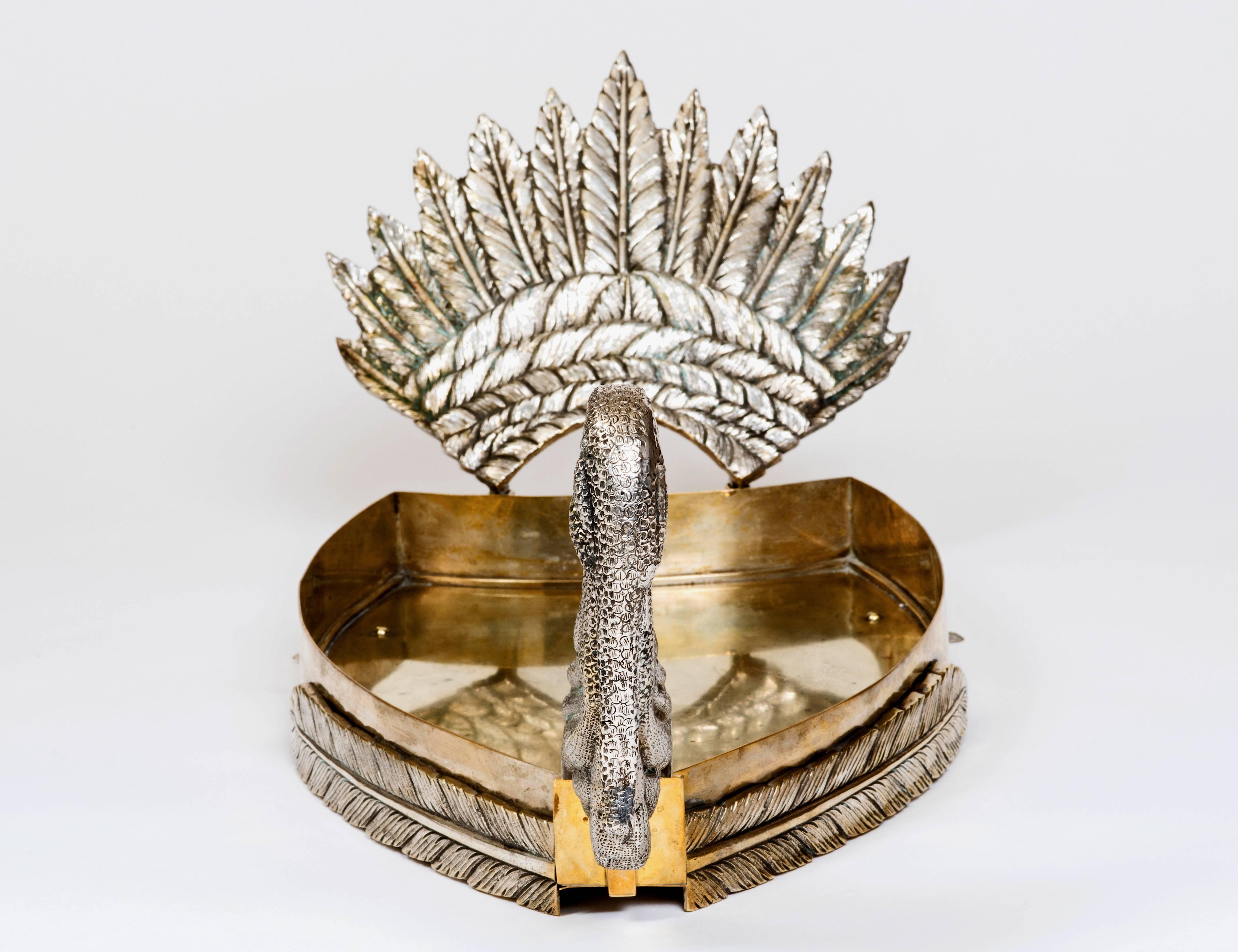 Extremely rare, extra large, English Turkey platter, circa 19th century no doubt one of a kind. Dramatic tail feathers adorn this platter along with exceptional detail and craftsmanship even down to his tiny back feet. Both his amazing head and tail