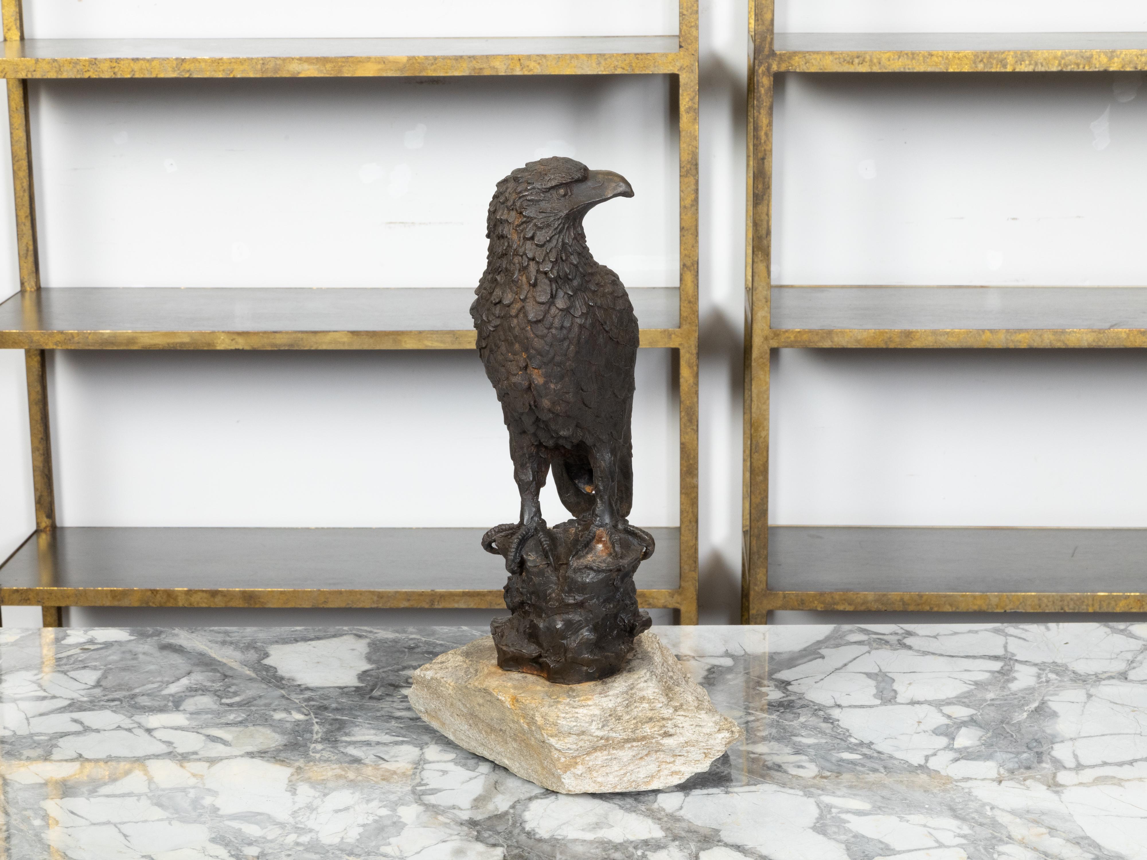 Stone English Turn of the Century Iron Sculpture of an Eagle Perched on a Rock For Sale
