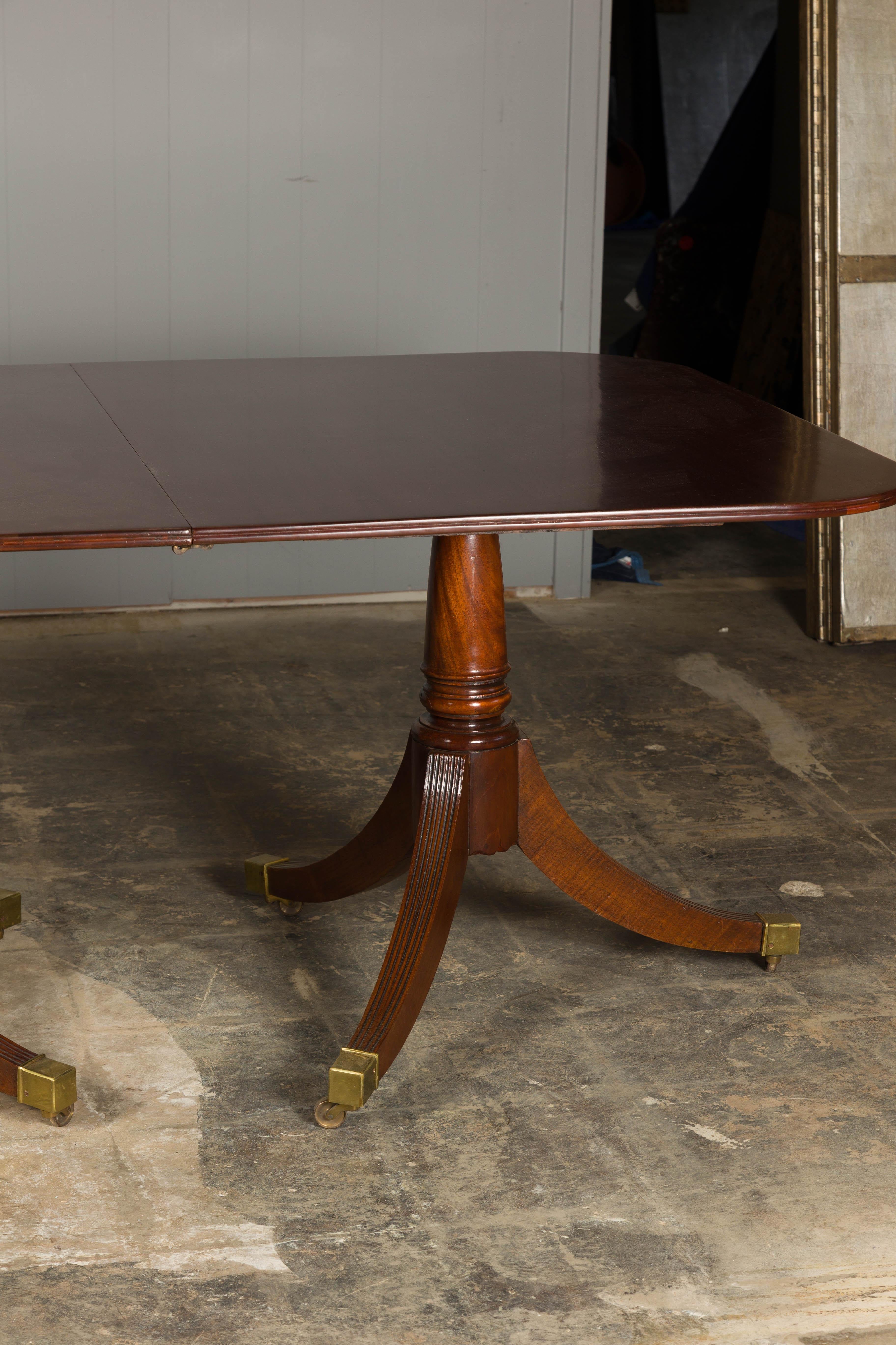 20th Century English Turn of the Century Mahogany Extension Dining Table with Quadripod Base For Sale
