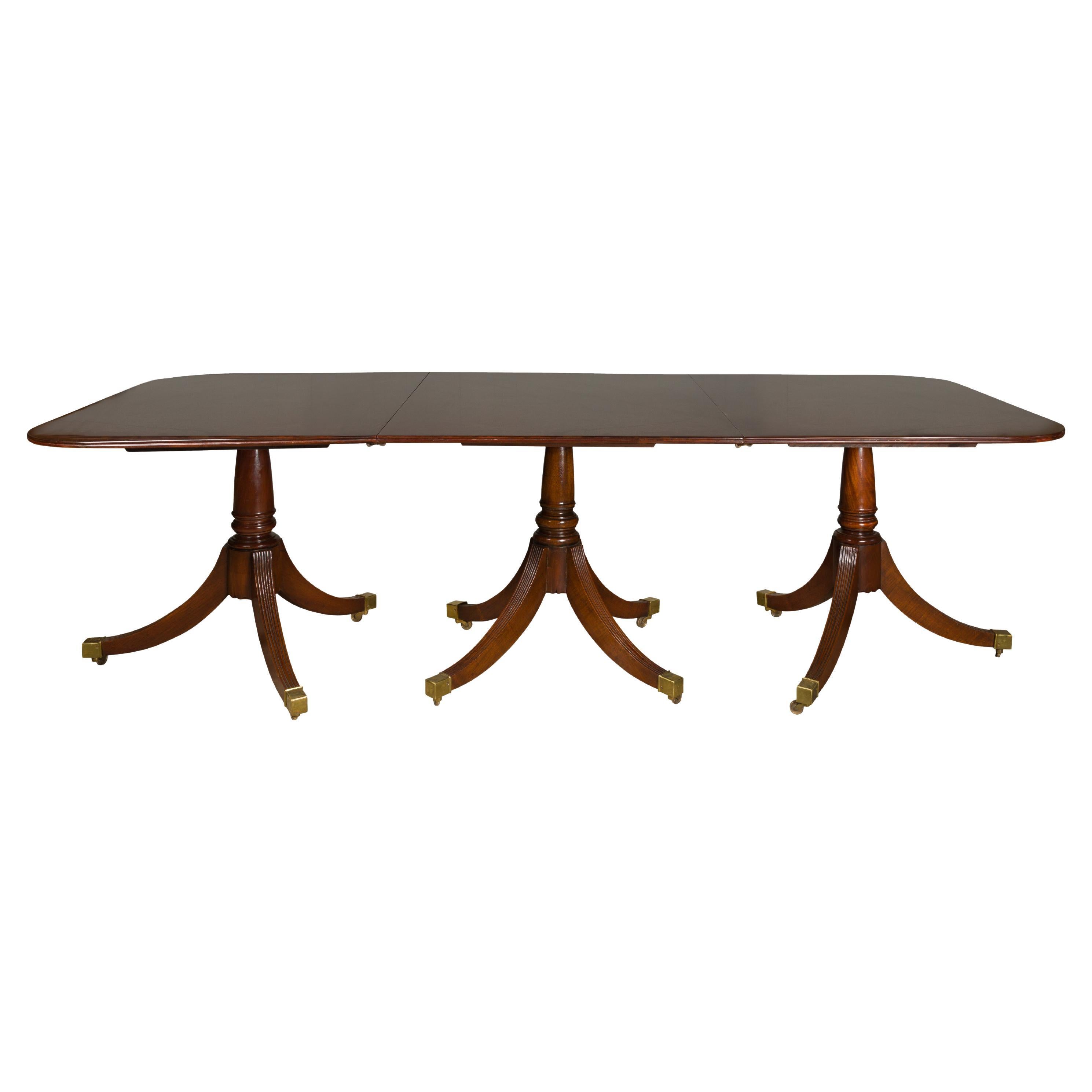 English Turn of the Century Mahogany Extension Dining Table with Quadripod Base