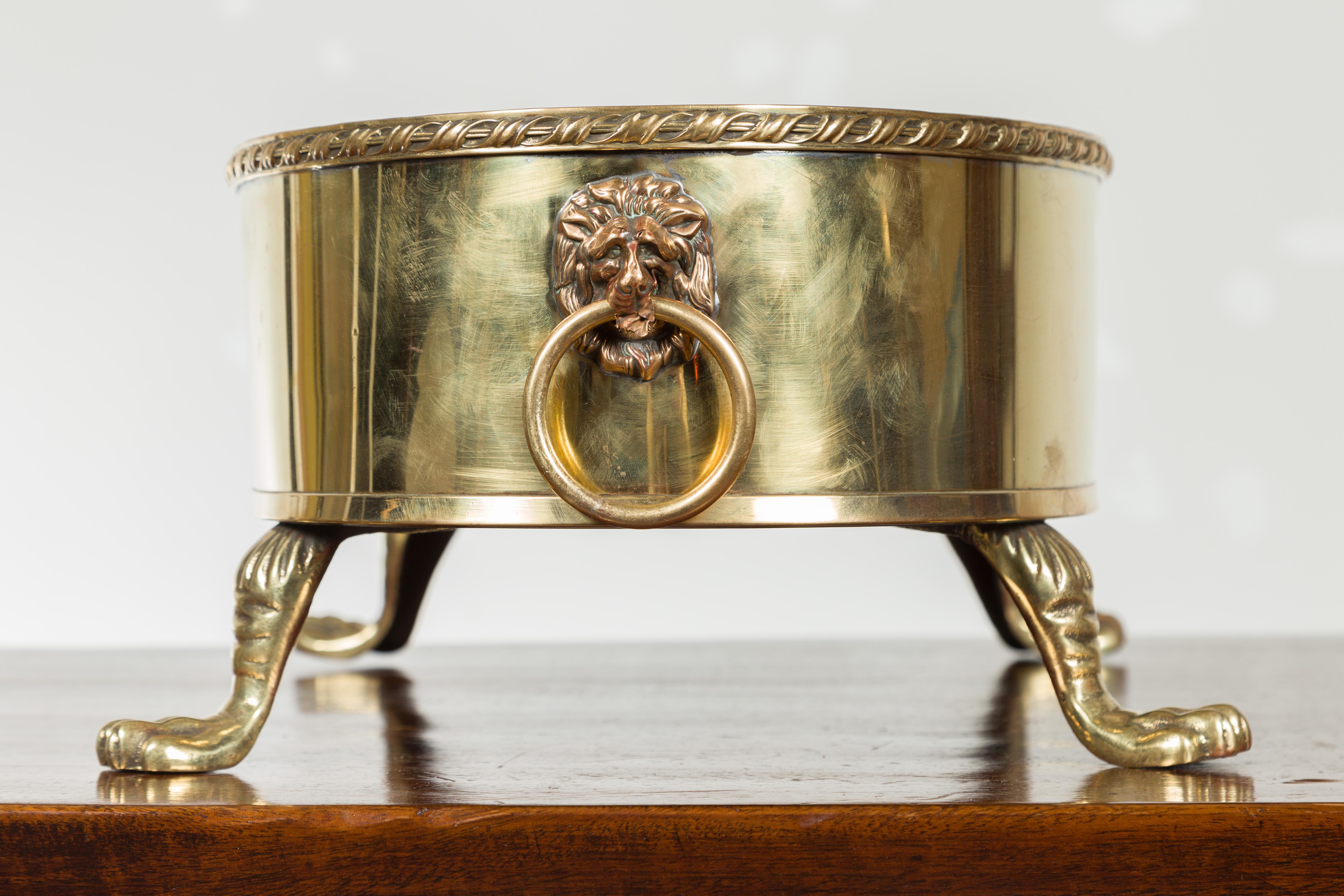 English Turn of the Century Oval Brass Cachepot with Lion Heads and Paw Feet 7