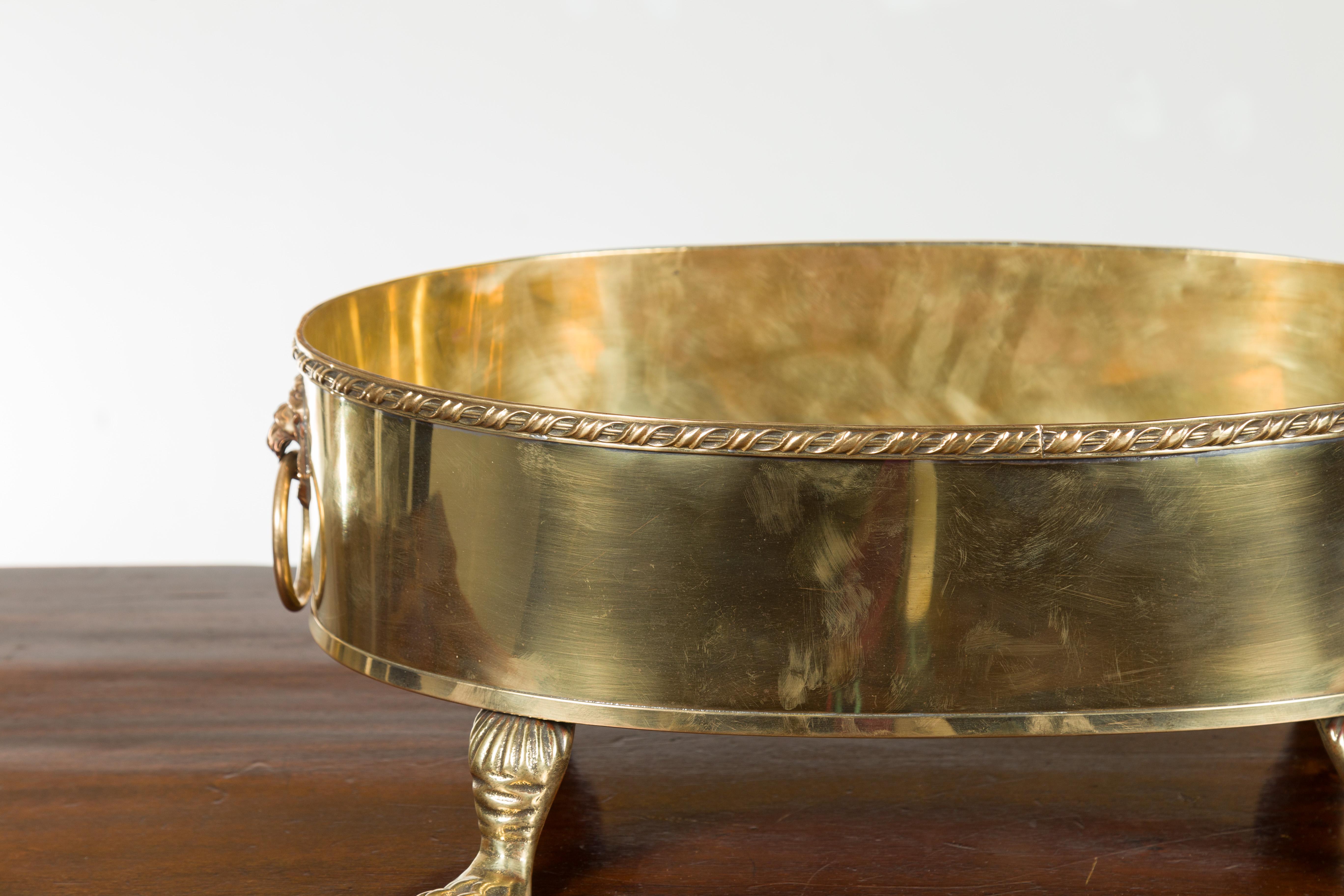English Turn of the Century Oval Brass Cachepot with Lion Heads and Paw Feet 1