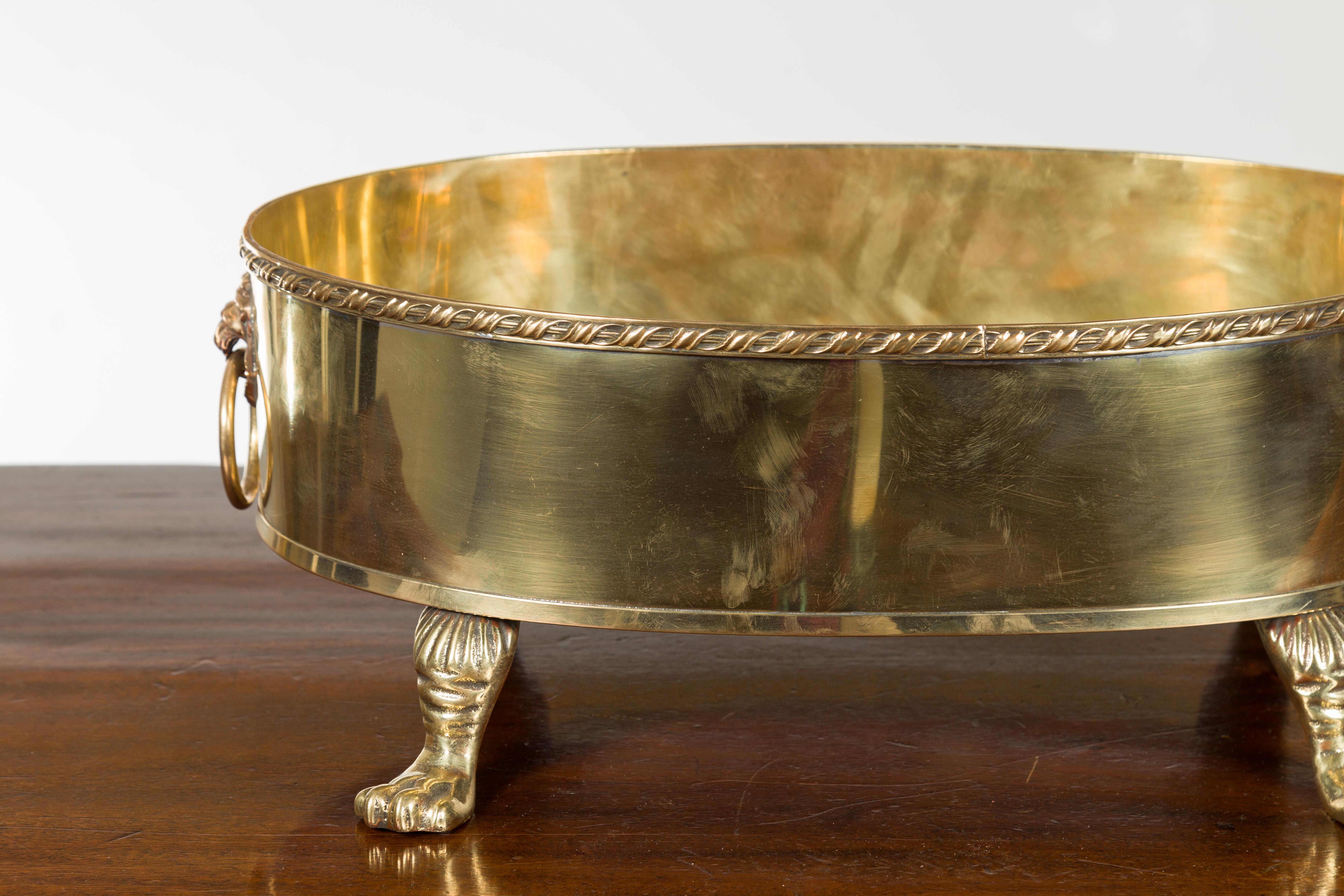 English Turn of the Century Oval Brass Cachepot with Lion Heads and Paw Feet 2