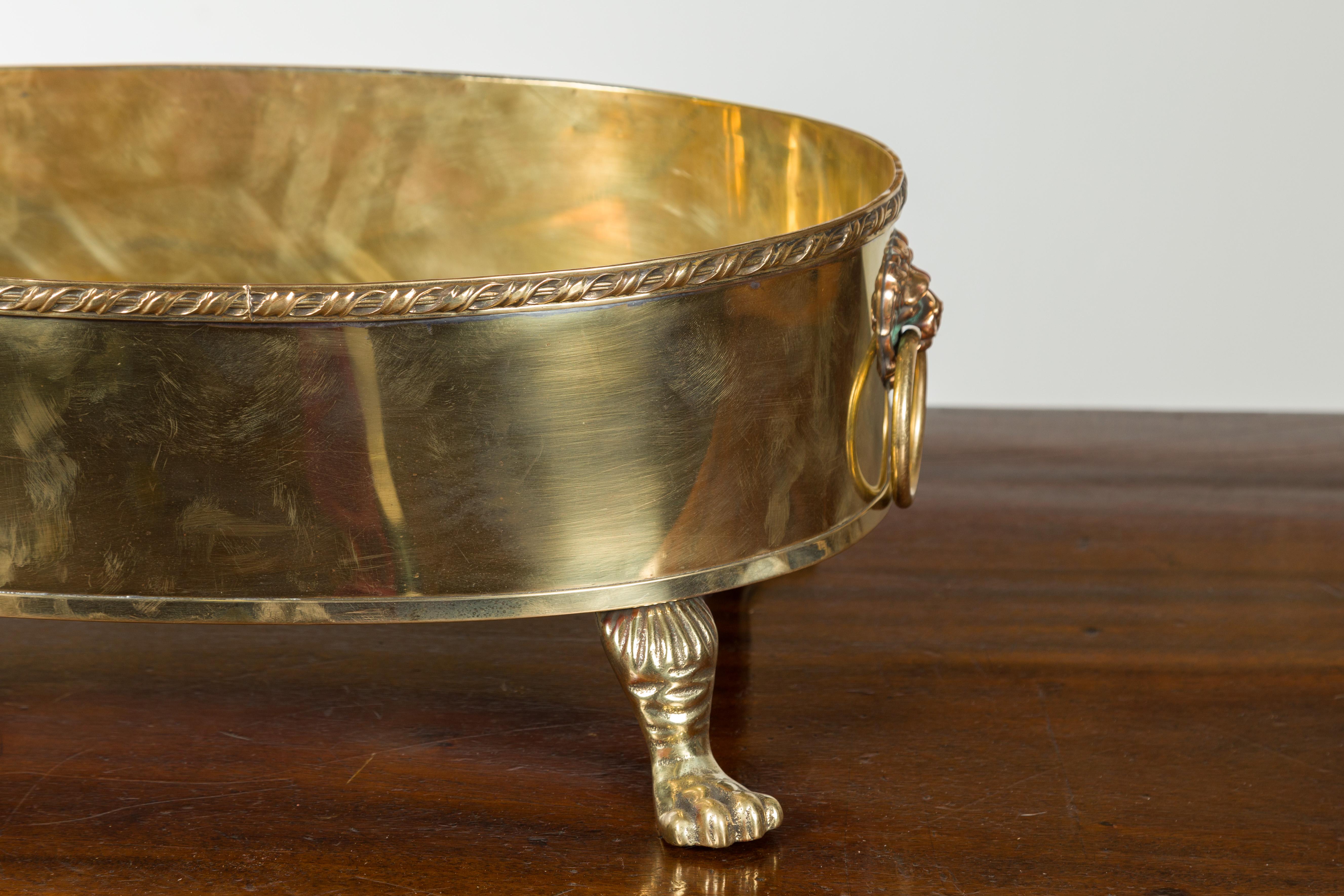 English Turn of the Century Oval Brass Cachepot with Lion Heads and Paw Feet 3