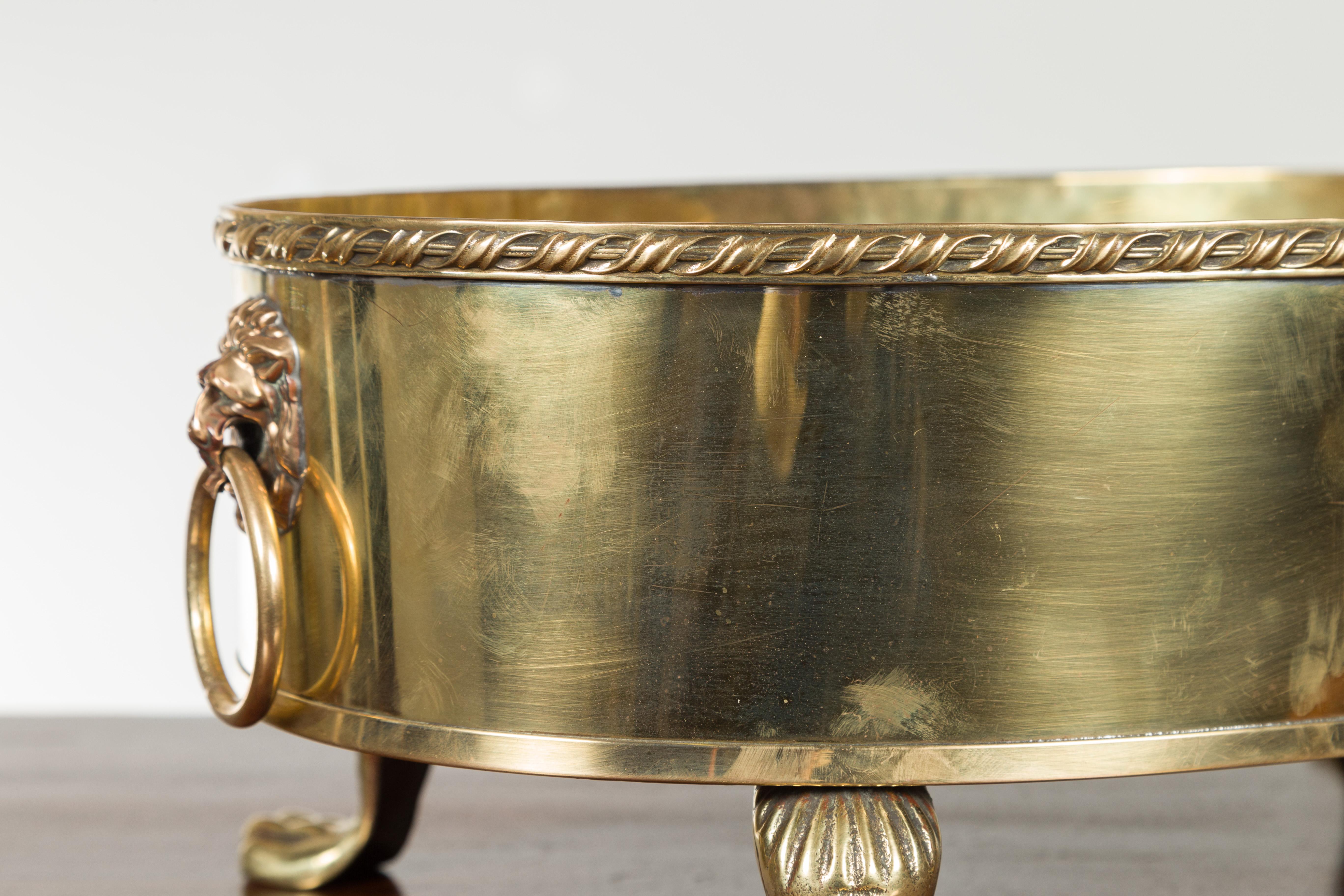 English Turn of the Century Oval Brass Cachepot with Lion Heads and Paw Feet 5