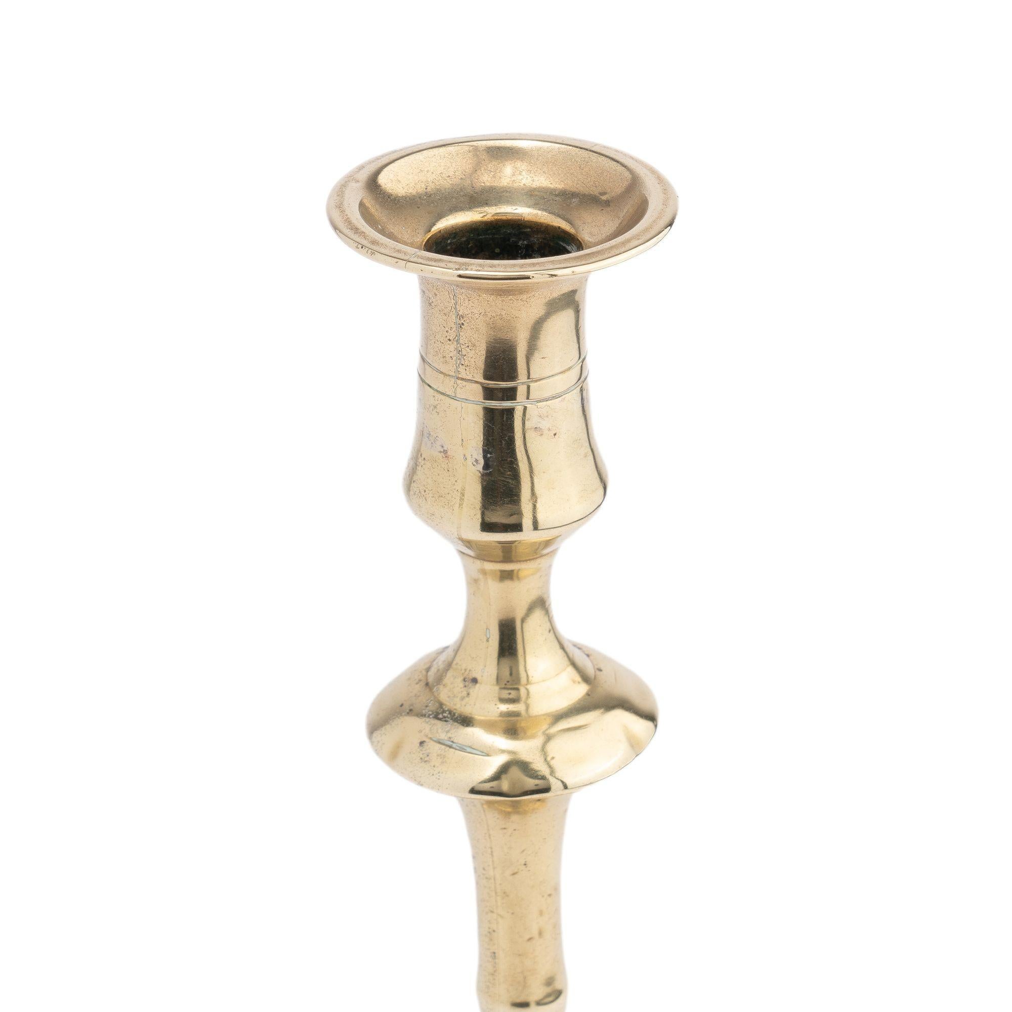 Queen Anne English two part seamed cast brass petal base candlestick, 1760 For Sale