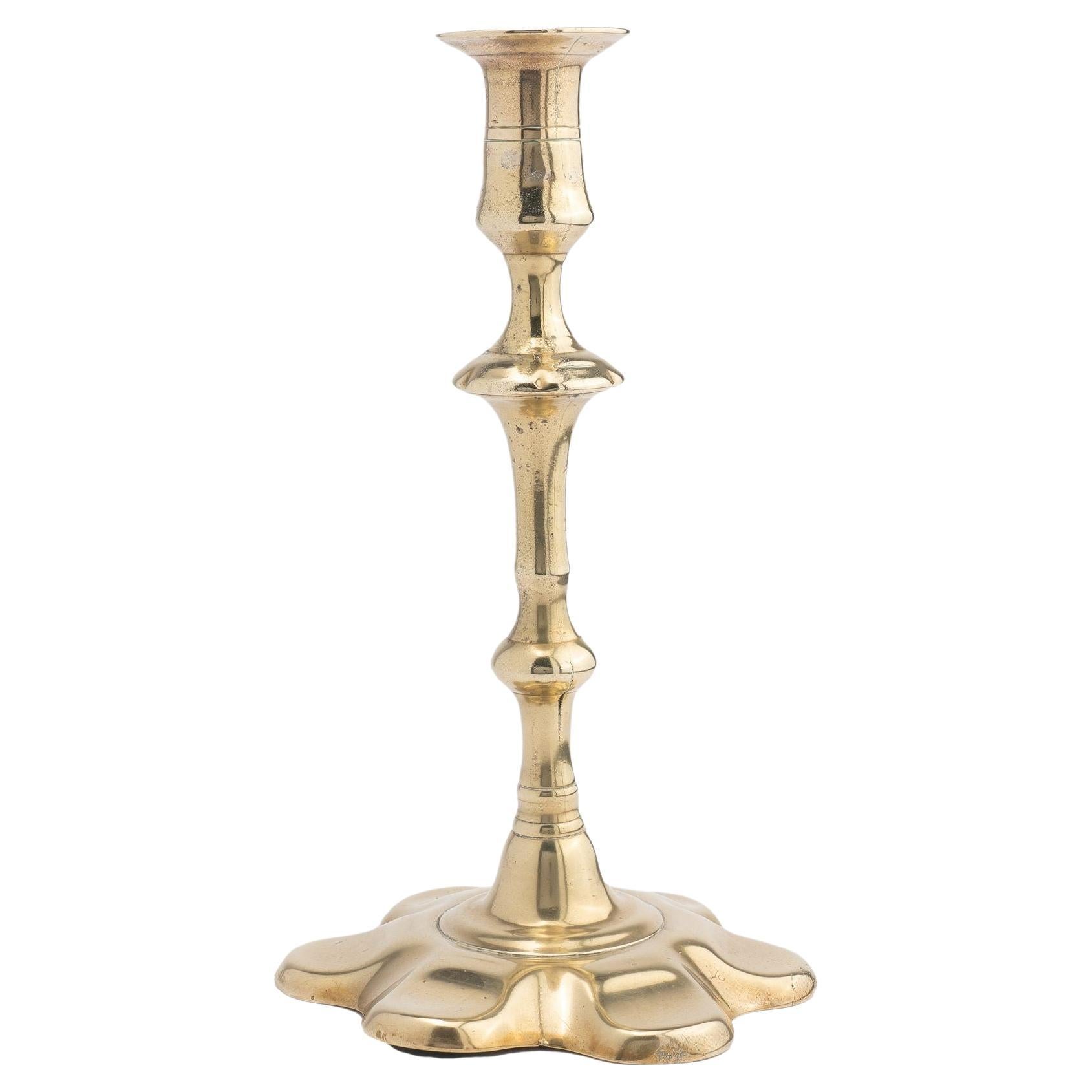 English two part seamed cast brass petal base candlestick, 1760 For Sale