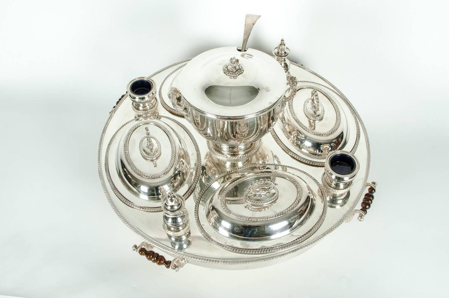 English very large silver plated / copper revolving center table super dish with four wood side handles and exterior design details with two cobalt blue insert dish. This super dish is just exquisite, each piece is detachable for storage and
