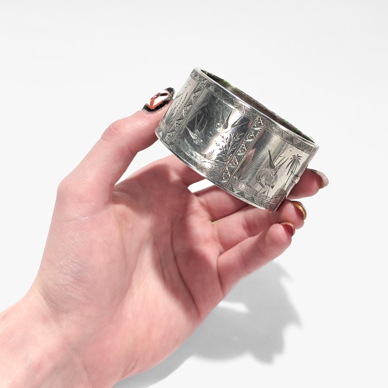 English Victorian Aesthetic Sterling Silver Bangle Bracelet with Scenes of Birds In Good Condition For Sale In Philadelphia, PA