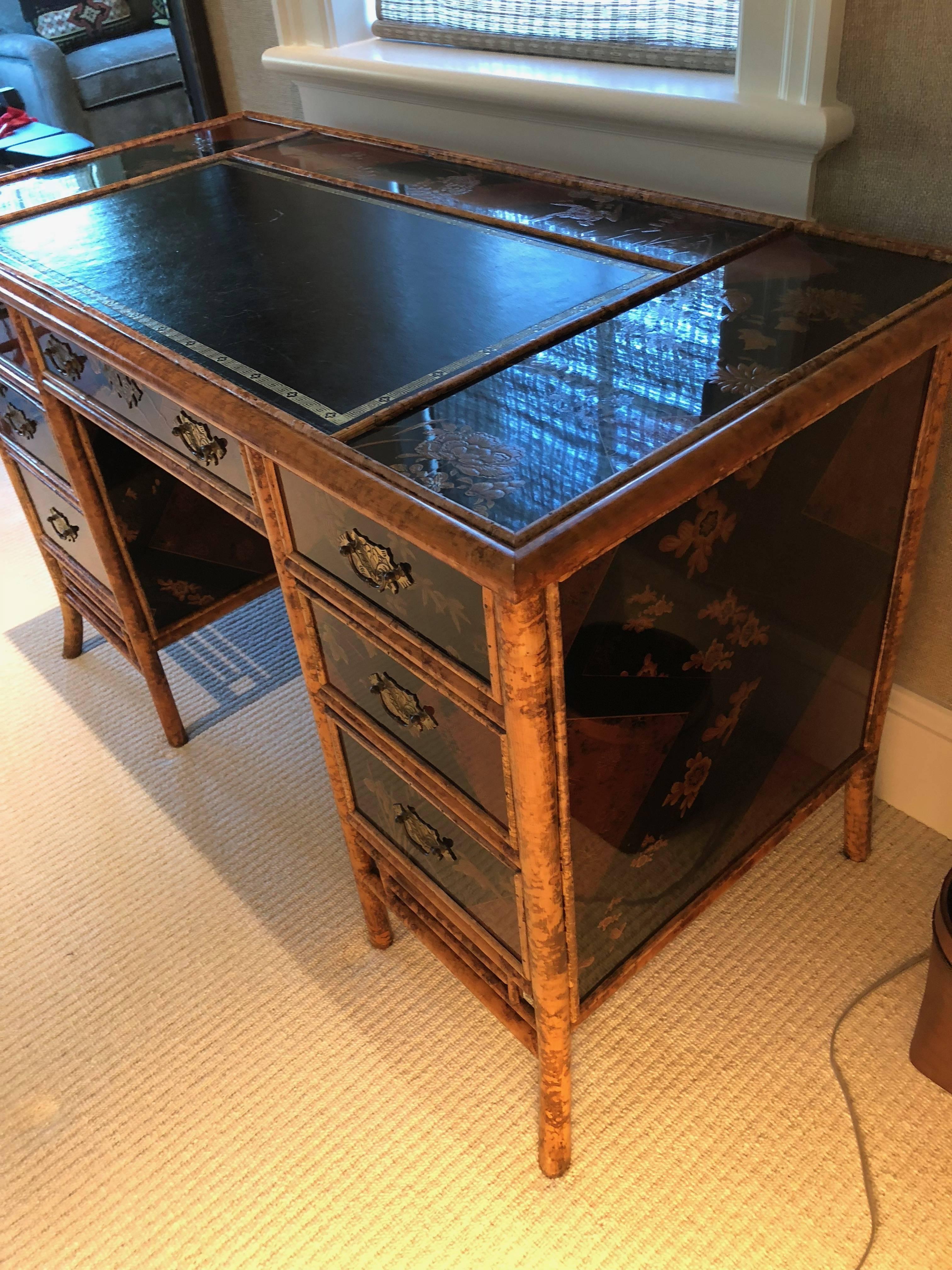 Bamboo English desk having seven drawers finished and decorated with hand-painted design and lacquer panels in the Japanese style well taken care of. Hand-painted on four sides made popular when commodore Perry opened Japan.