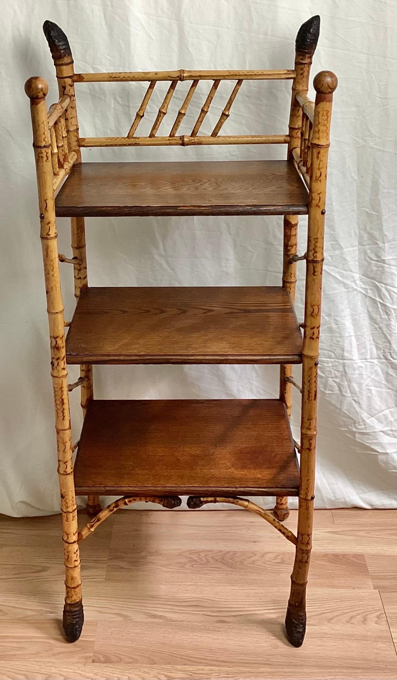 English Victorian Bamboo Étagère with nice oak shelves. One of the better ones I have had over the years. Nice size and nice details on the feet and top. I found some small filled holes. It may have had more shelves originally.
Local pick-up and or