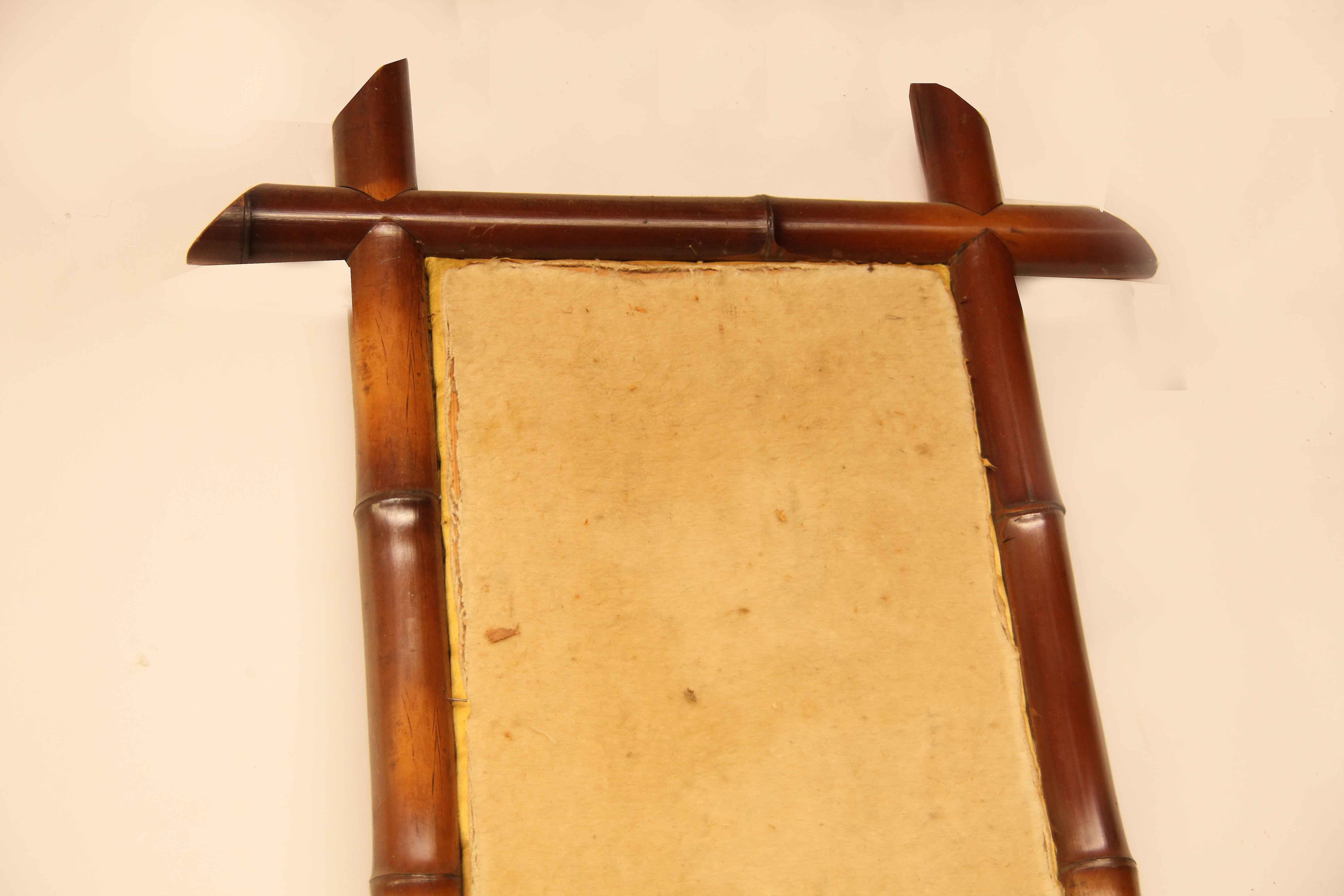 English Victorian bamboo frame with original cloth mounted on a pine stretcher; it retains the original bamboo loops for hanging ( but one has some wear so probably ill advised to use), there are metal swivel hooks attached at each end for vertical
