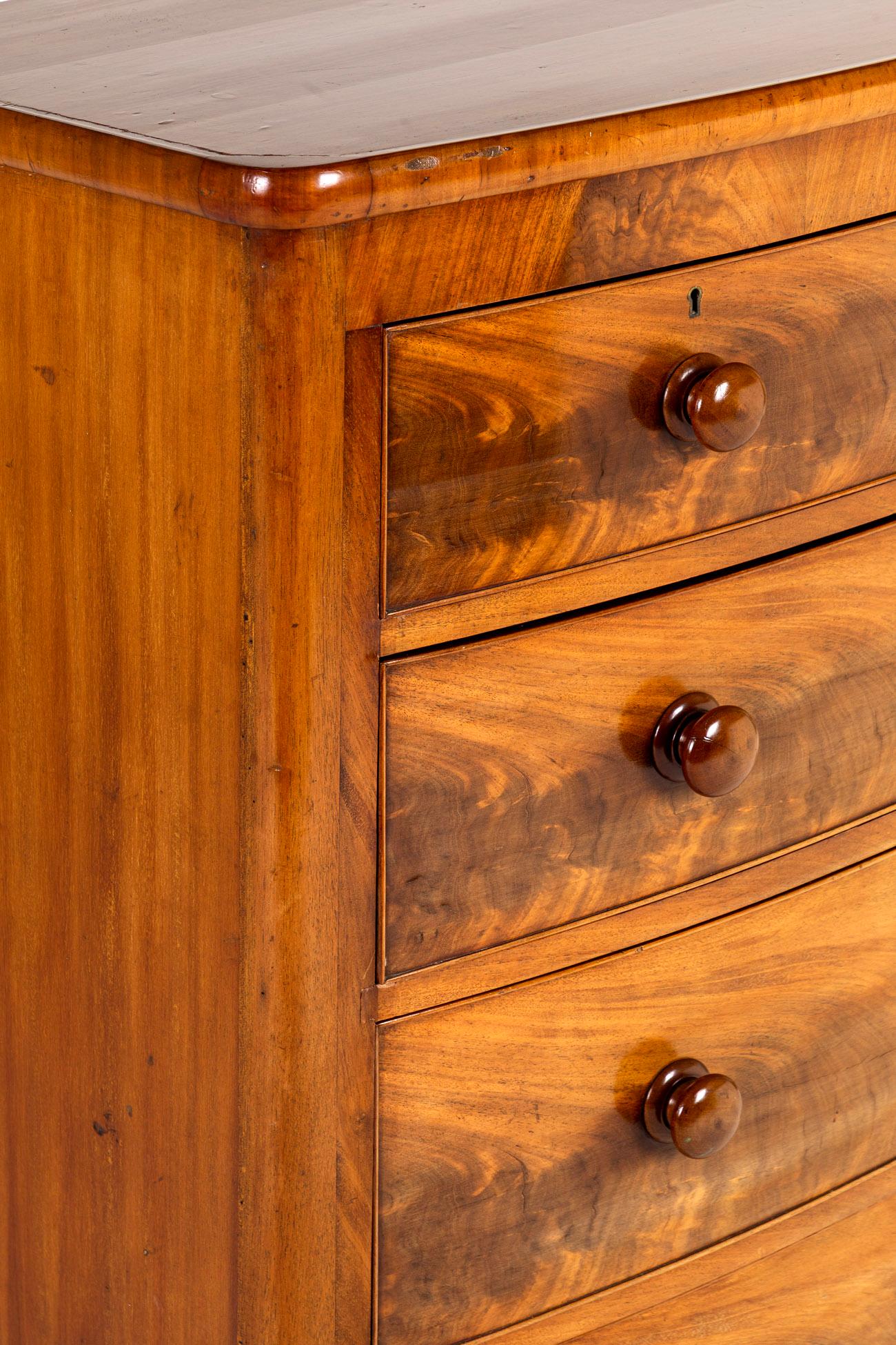 Hand-Carved English Victorian Bow Fronted Chest Of Drawers For Sale