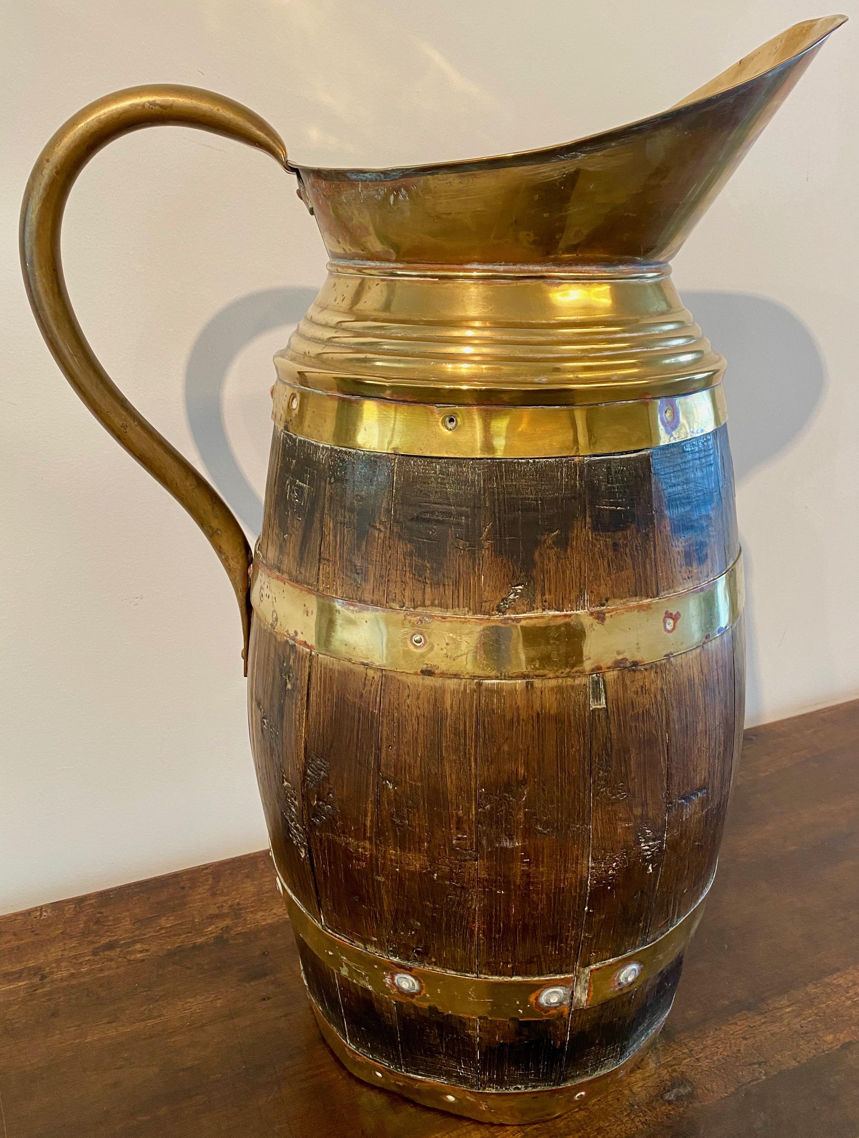 English Late Victorian brass coopered oak coal barrel with brass handle and spout, late 19th century.