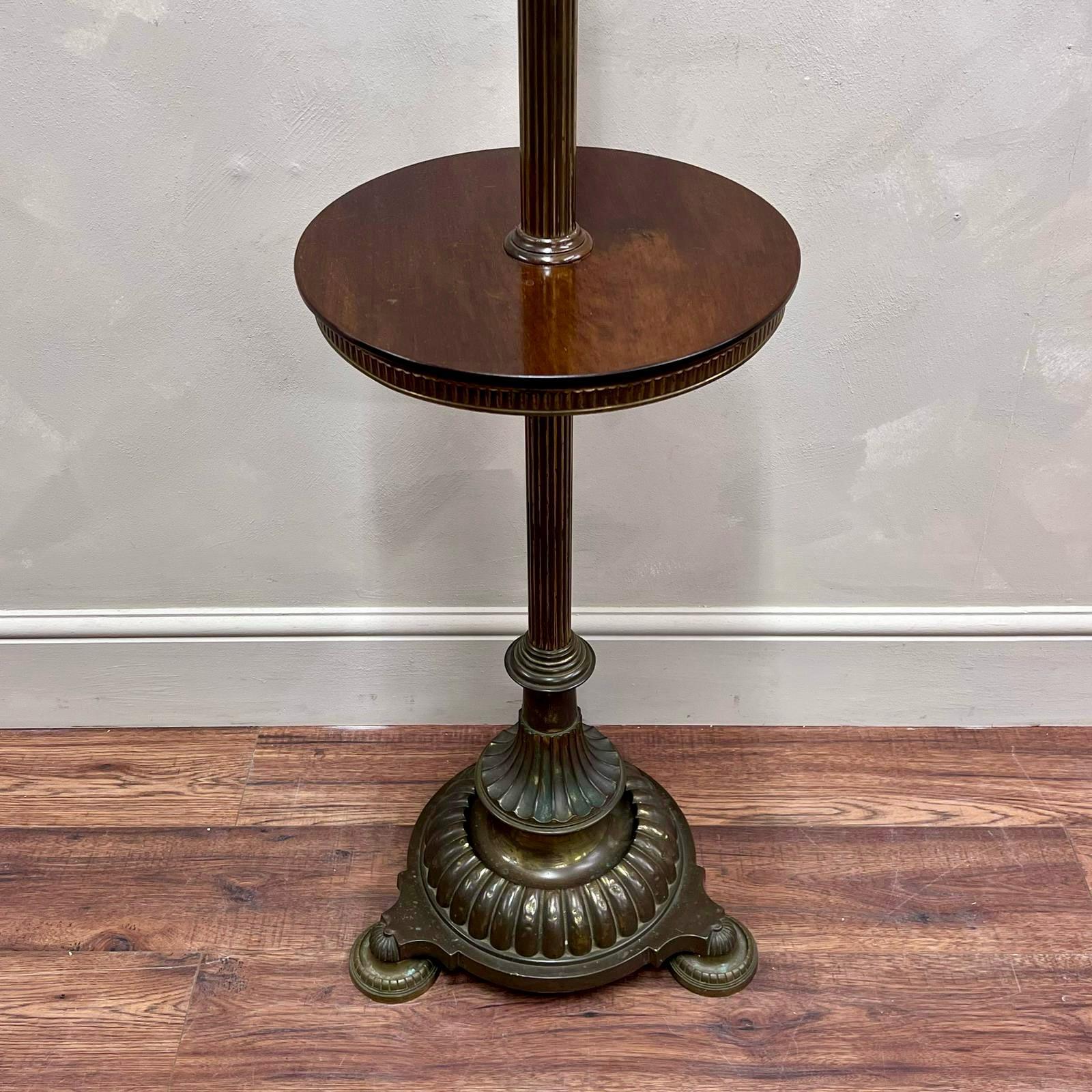 19th century, brass floor lamp with a very useful polished mahogany side table, perfect for beside a chair as shown.
Beautifully detailed, sturdy base.
Fully wired and pat tested , we can change the wiring to suit your needs if required .
Currently