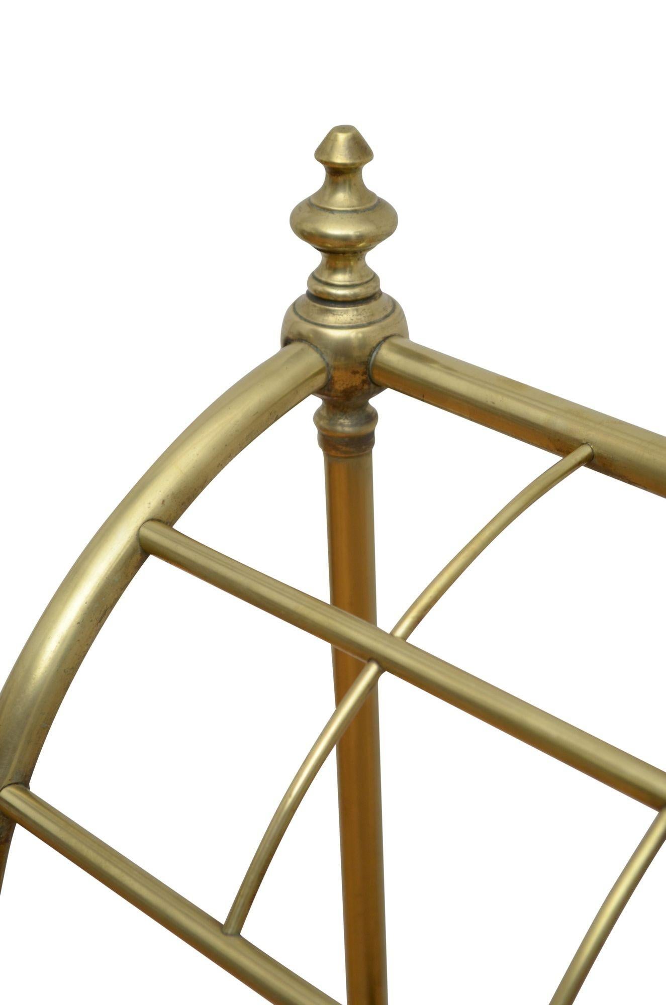 P0264 English brass umbrella stand / walking stick stand round form with six divisions, two decorative finals and removable drip tray in cast iron base. This antique umbrella stand retains its original finish, patina and antique character, all in
