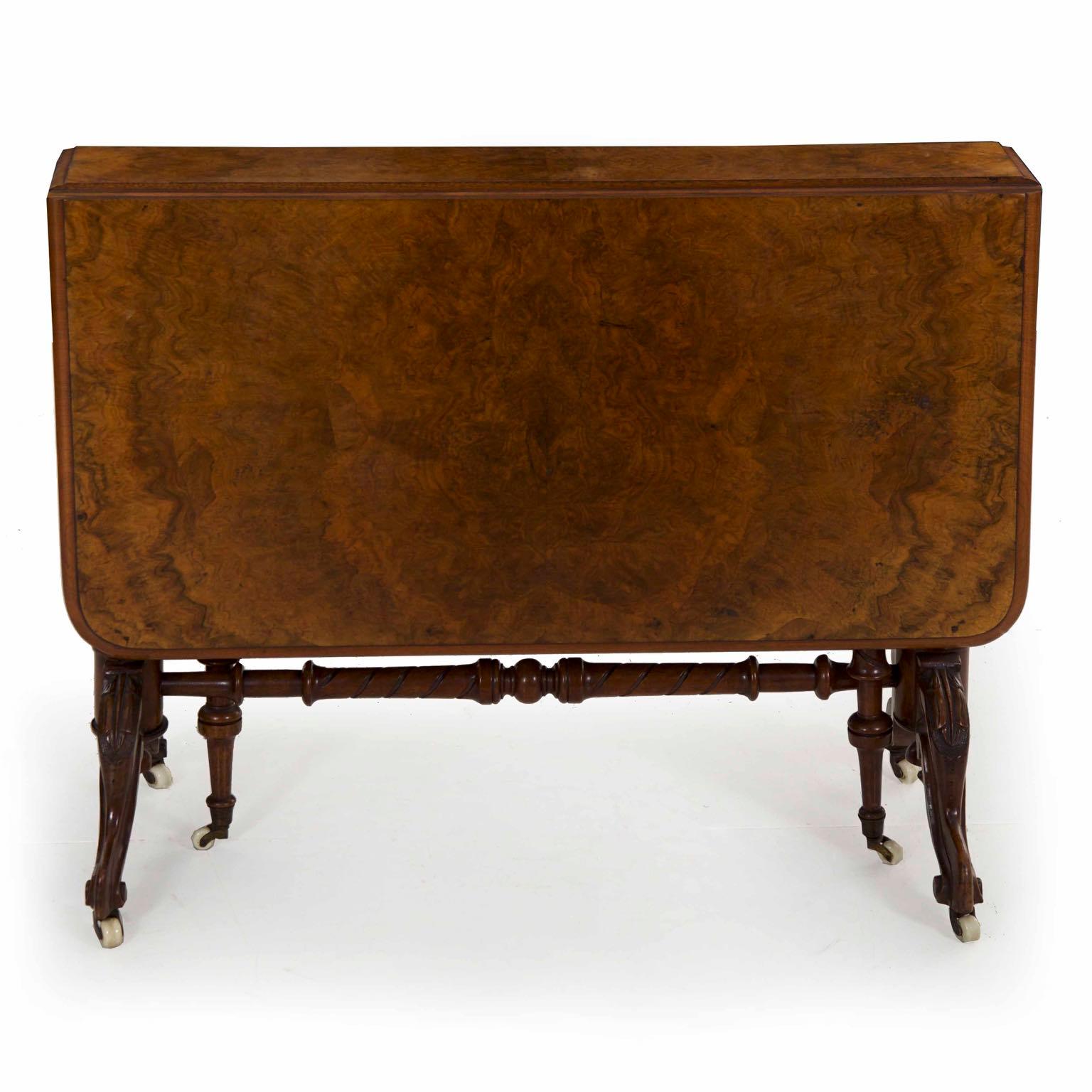 Victorian burl walnut and carved mahogany Sunderland table
England, circa third quarter of the 19th century


This table form is generally known as “Sunderland”, being characterized by a somewhat extreme shallowness of depth with long drop