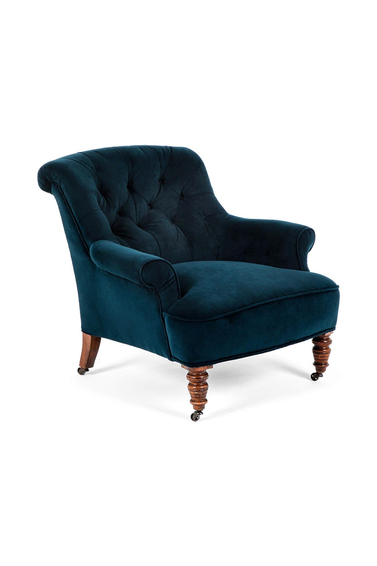 A demure 19th century Victorian nursing chair with a deep buttoned backrest and low scrolled armrests.

The chair is raised on beautifully turned mahogany legs and finished on brass castors.

The armchair has been fully restored and stripped back to