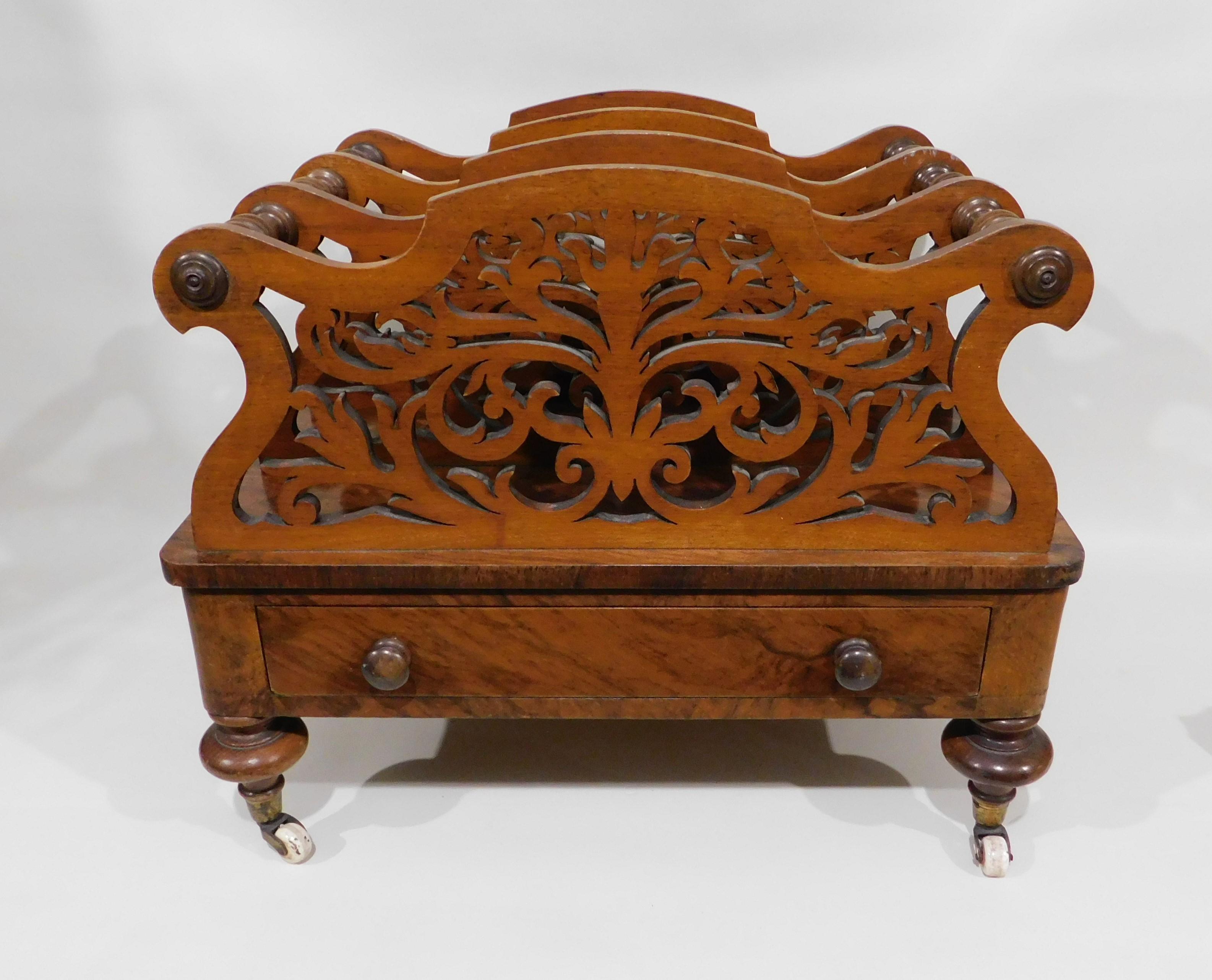 Victorian burled walnut and veneer Canterbury rack to hold sheet music or magazines with one drawer and porcelain ceramic wheels, circa 1840.