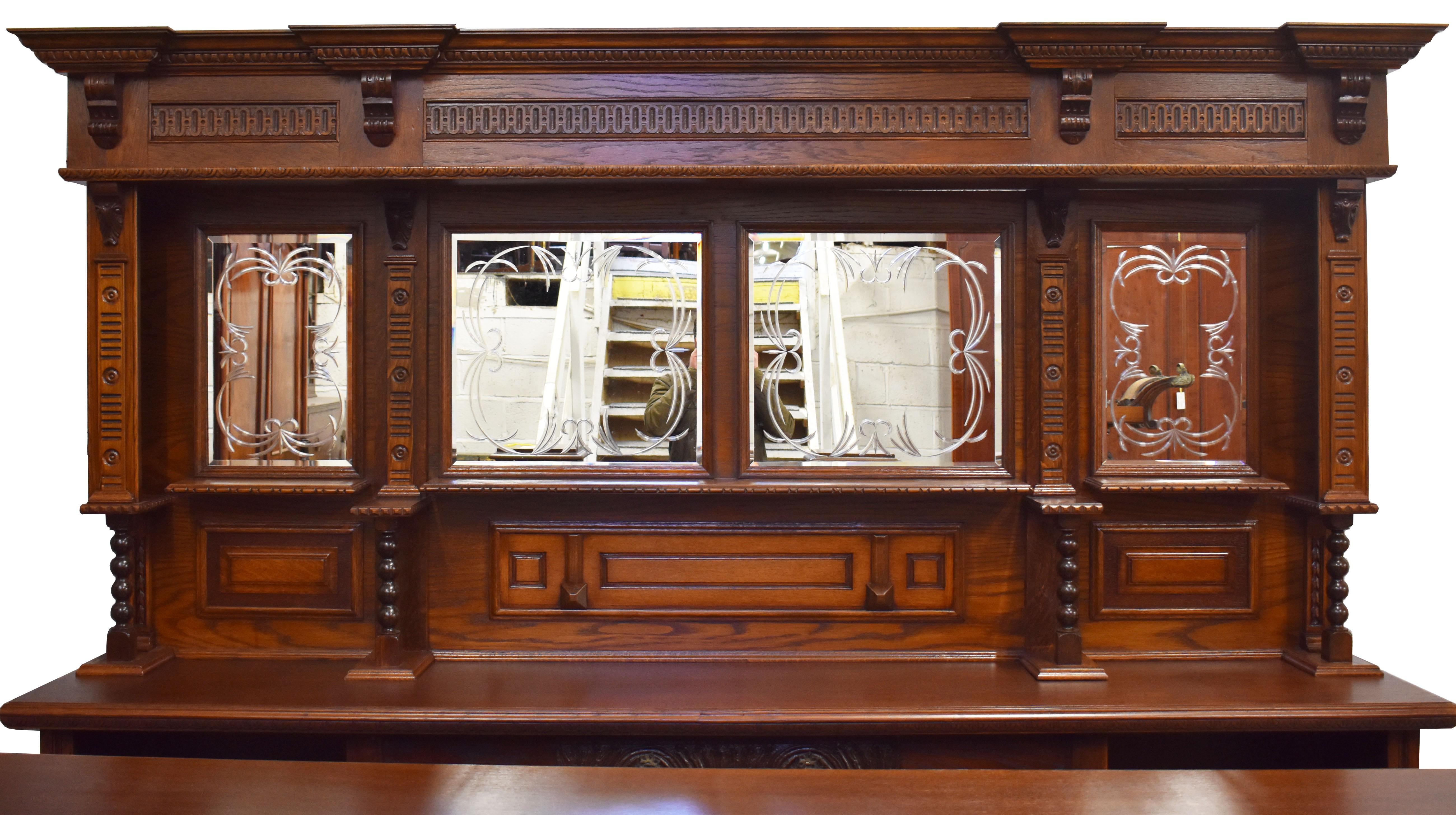For sale is a Victorian style carved oak front and back bar, having a carved cornice above a mirror back section. The front bar The front bar is ornately carved with four panels. Overall, the bar is in good condition for its age having been fully