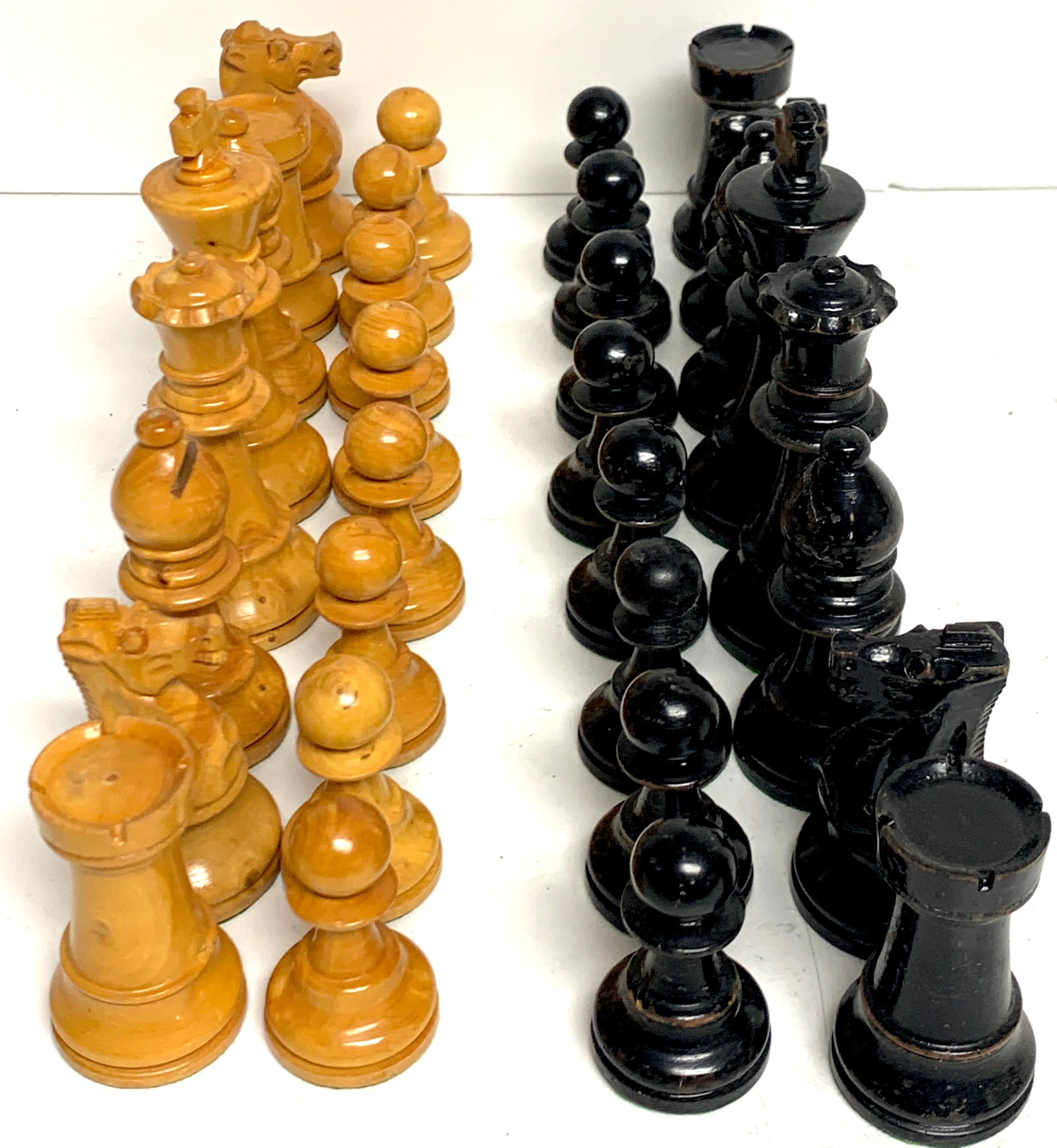 English Victorian carved satinwood and ebonized chess pieces, a complete 32 piece set, subtly carved, nice weight, nice to hold. The tallest piece is 4-inches high.