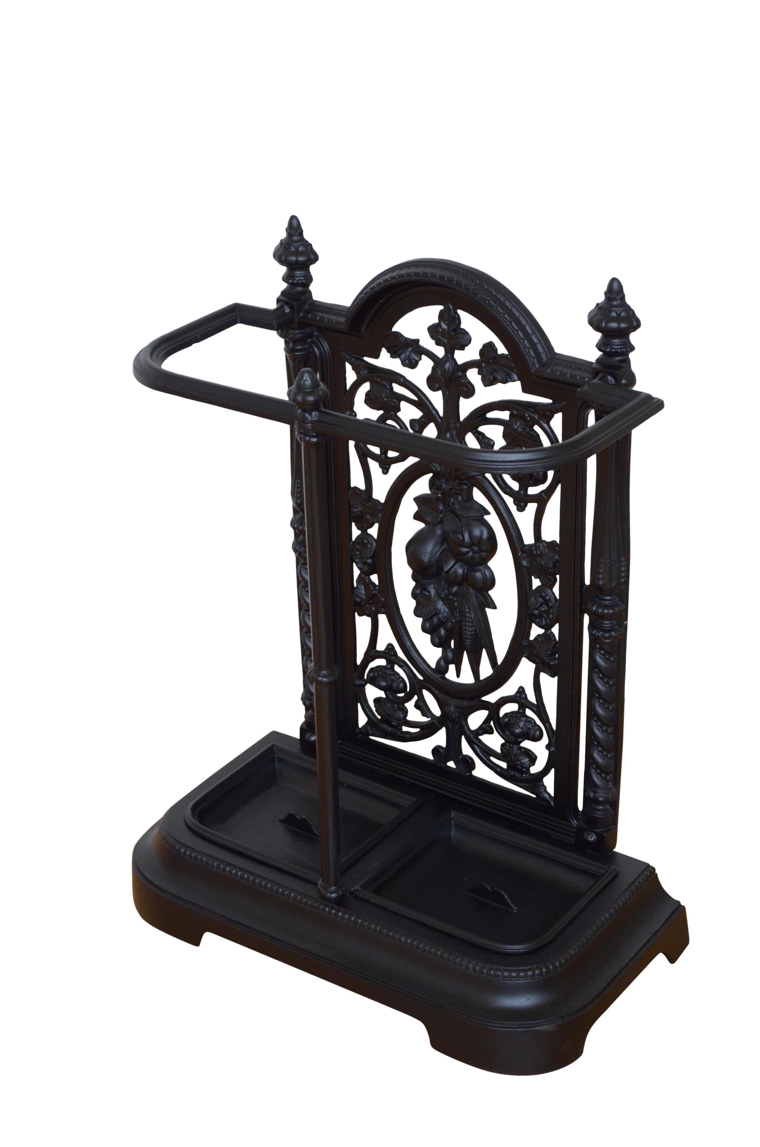 K0386 Attractive Victorian umbrella stand / walking stick stand in cast iron with intricate pierced floral and leaf design, umbrella holder and two removable drip trays. 
 
This antique hall stand is in home ready condition. c1880
 
H26 3/4''