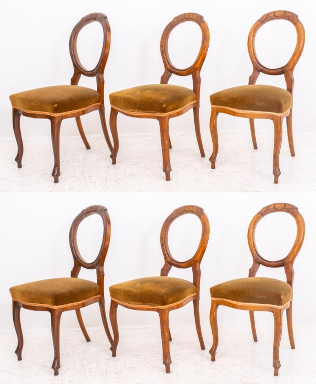 Group of six English Victorian carved cherry wood chair, open back, tapered cabriole legs, seat upholstered in brown velvet, circa late 19th century.

Dimensions: 37