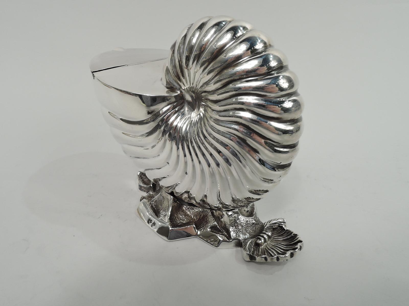 Victorian Classical sterling silver spooner. Made by Frederick Elkington in Birmingham in 1880. Fluted nautilus shell. Cover plain and hinged. Striated and irregular seabed base with scallop shell thumb rest. Fully marked. Weight: 16.5 troy ounces.