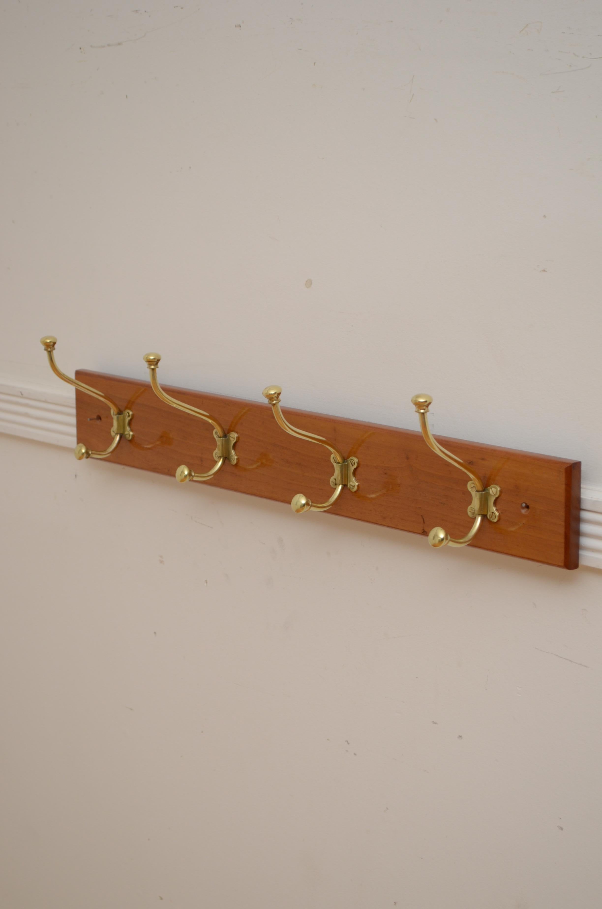 K0280 Fine English Victorian walnut coat rack with four shaped coat and hat hooks in brass on solid walnut backing. Cleaned and polished, ready to place at  home. c1880
Please view our full selection of coat racks and coat stands.
H6 1/4