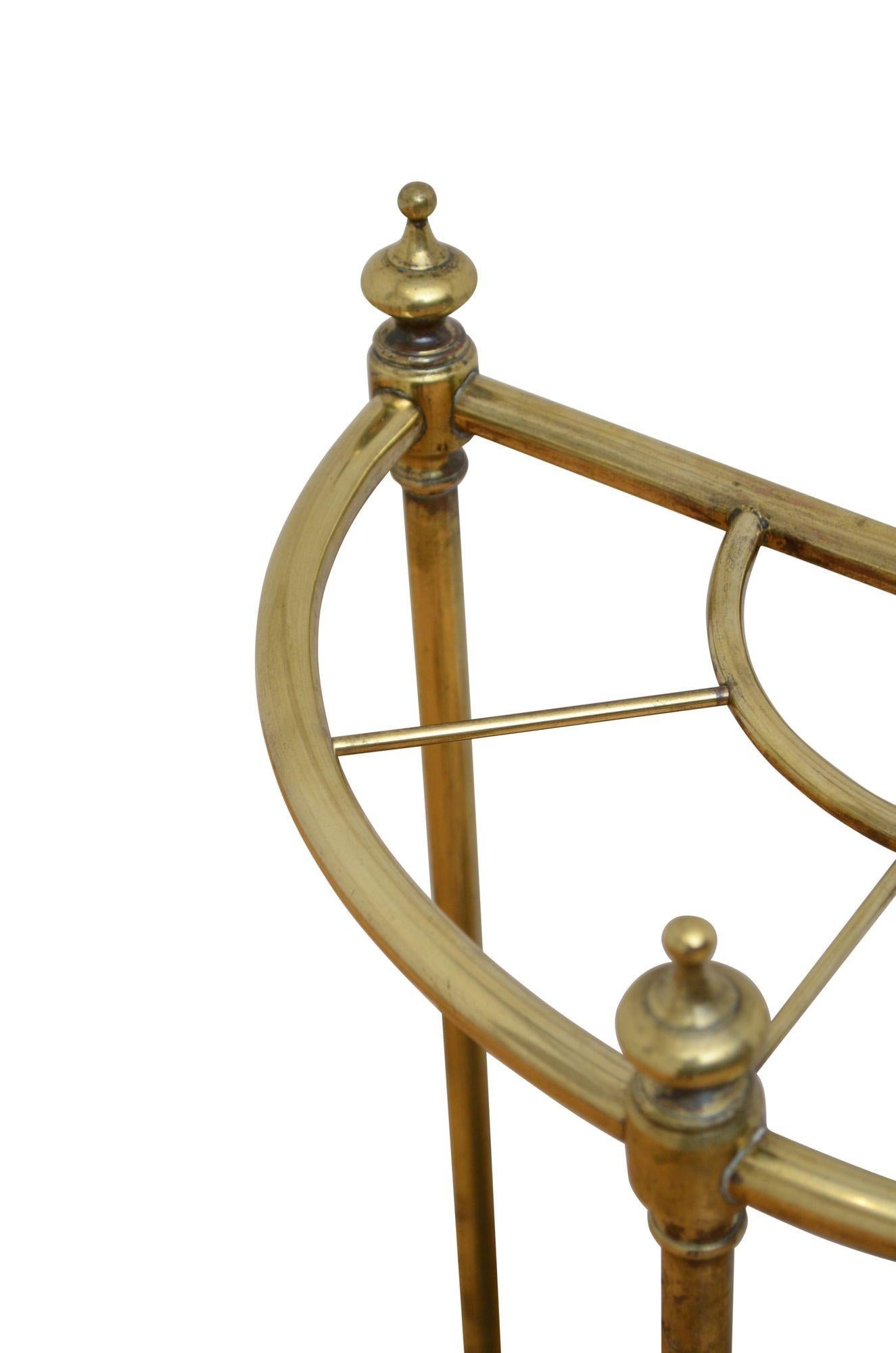 P0266 English Victorian brass umbrella stand or walking stick stand with five divisions, three decorative finials and cast iron drip tray. This antique hall stand has been sympathetically cleaned, it retains its antique character and is ready to