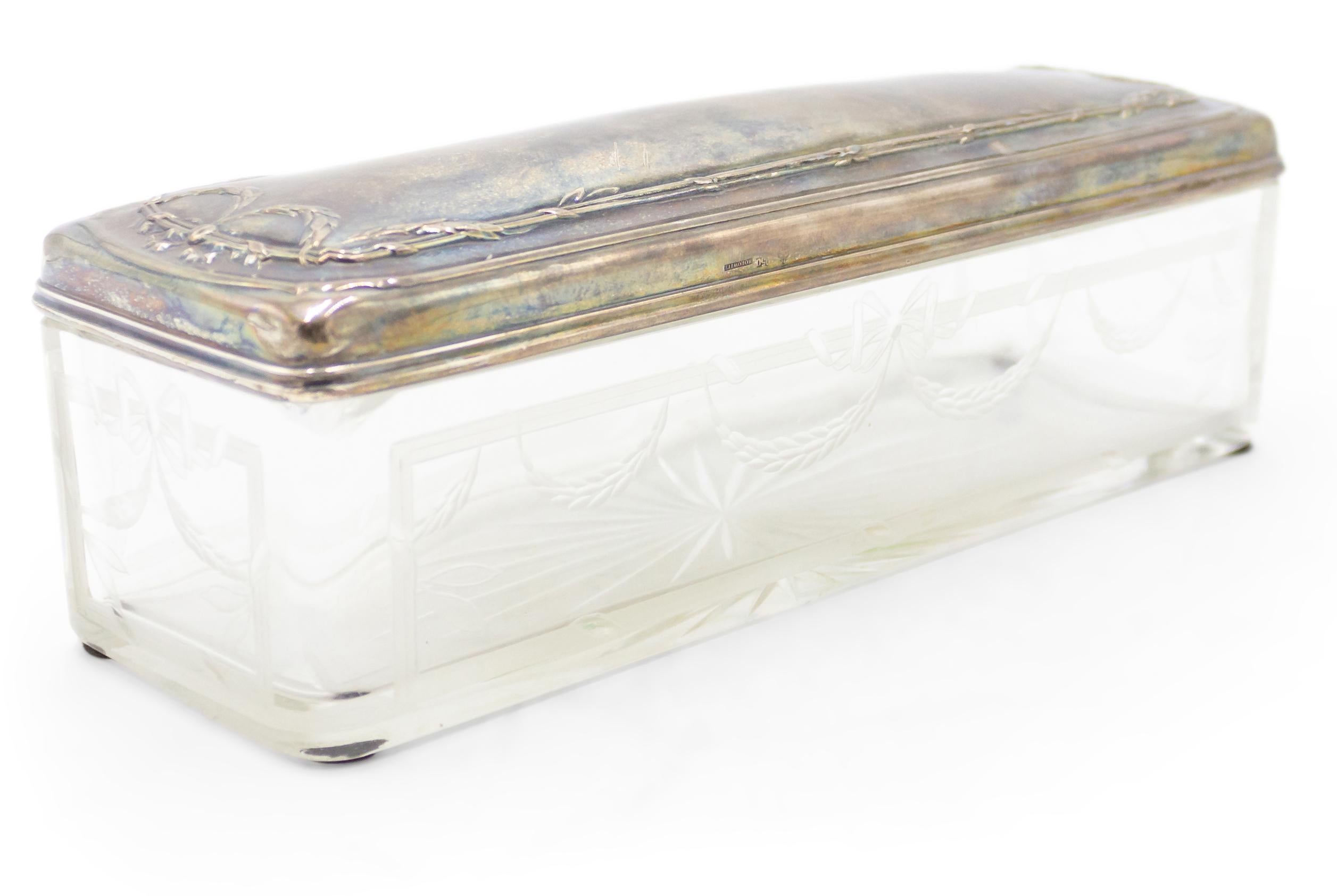 English Victorian oblong shaped box with etched design and silver top.
 
