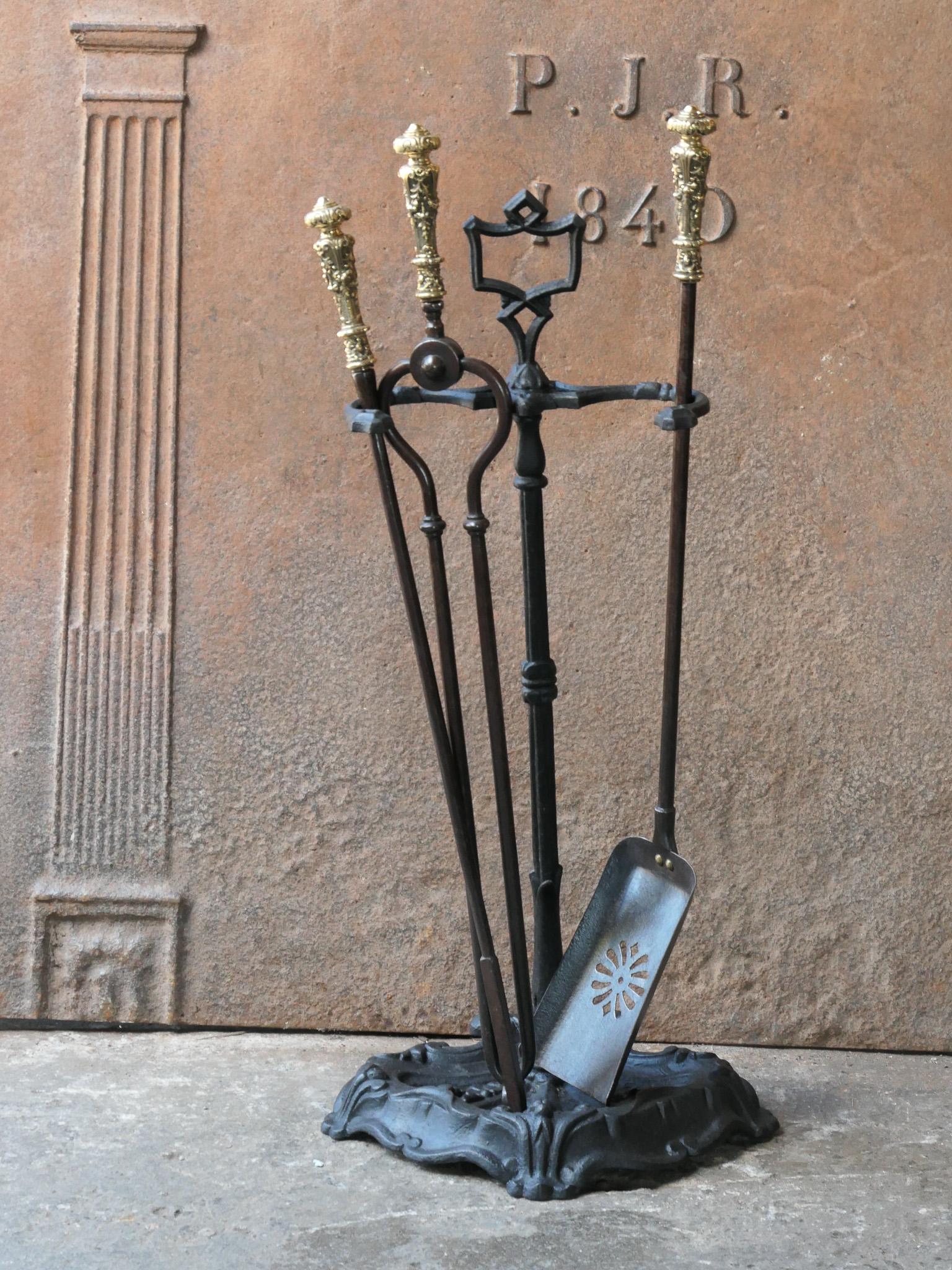 19th century English Victorian period fireplace toolset. The tools are made of wrought iron with bronze handles, while the stand is made of cast iron. The toolset consists of tongs, shovel and stand. The condition is good.








.