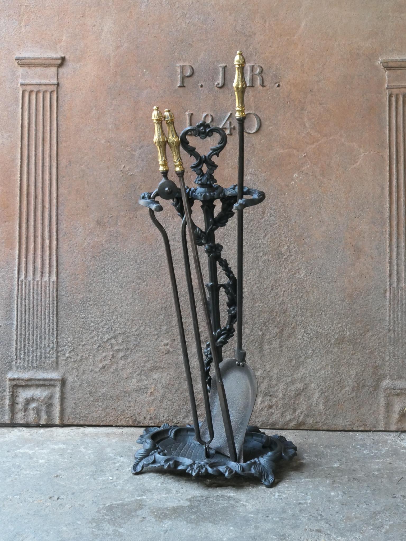 19th century English Victorian period fireplace toolset. The tools are made of wrought iron with bronze handles, while the stand is made of cast iron. The toolset consists of tongs, shovel and stand. The condition is good.








.