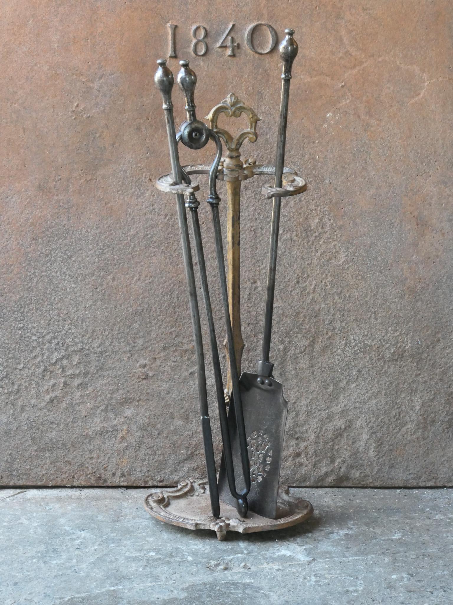 19th century English Victorian period fireplace toolset. The tools are made of wrought iron, while the stand is made of brass. The toolset consists of tongs, poker, shovel and stand. The condition is good.








.