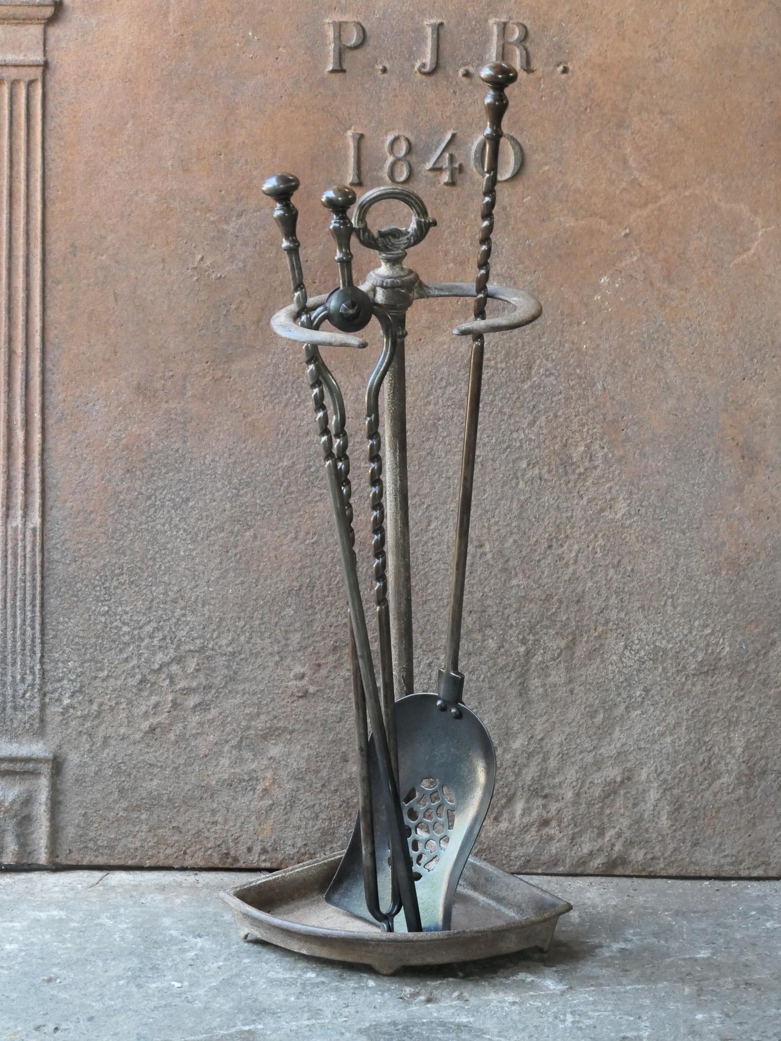 19th century English Victorian period fireplace toolset. The tools are made of wrought iron, while the stand is made of cast iron. The toolset consists of tongs, poker, shovel and stand. The condition is good.








.
