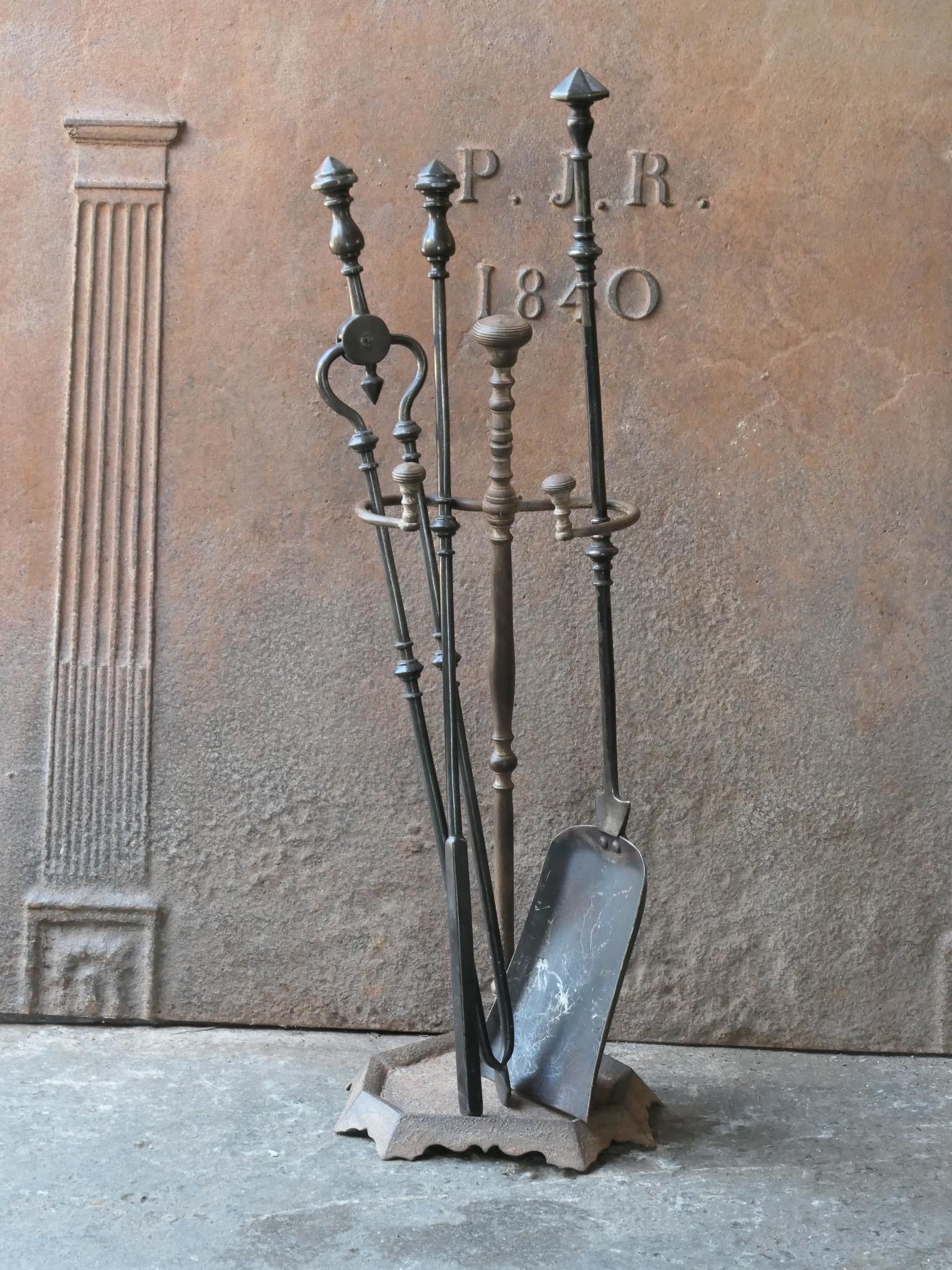 19th century English Victorian period fireplace toolset. The tools are made of wrought iron, while the stand is made of cast iron and wrought iron. The toolset consists of tongs, shovel and stand. The condition is good.








.