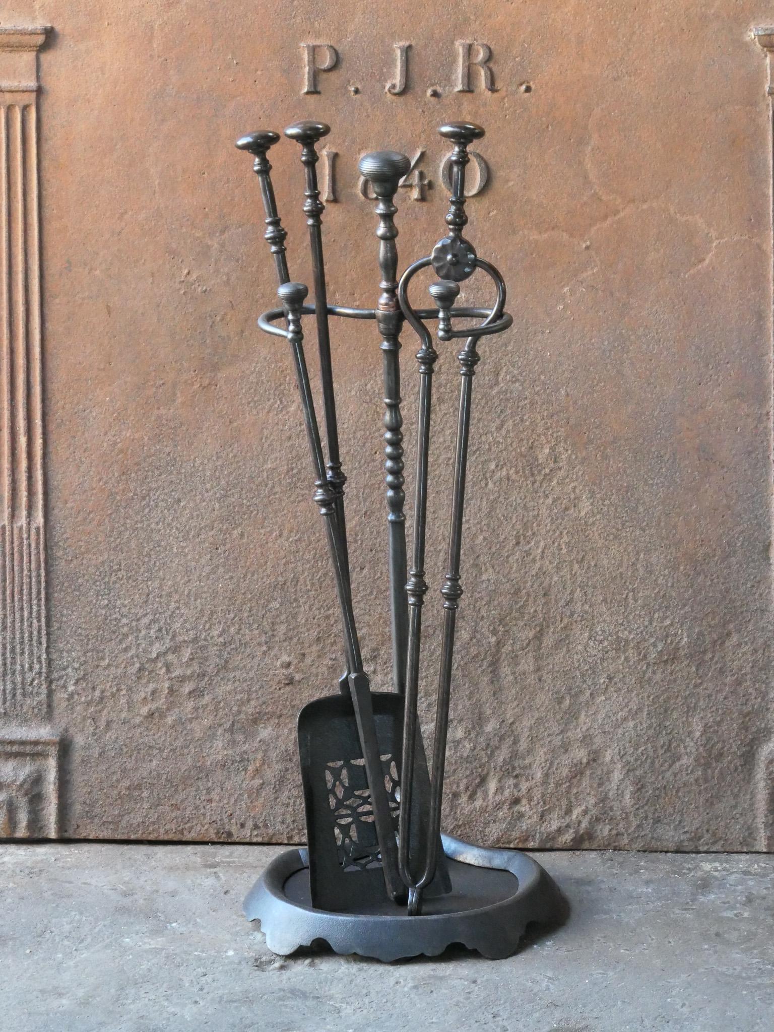 19th century English Victorian period fireplace toolset. The tools and stand are made of wrought iron. The toolset consists of tongs, shovel, poker and stand. The condition is good.








.
