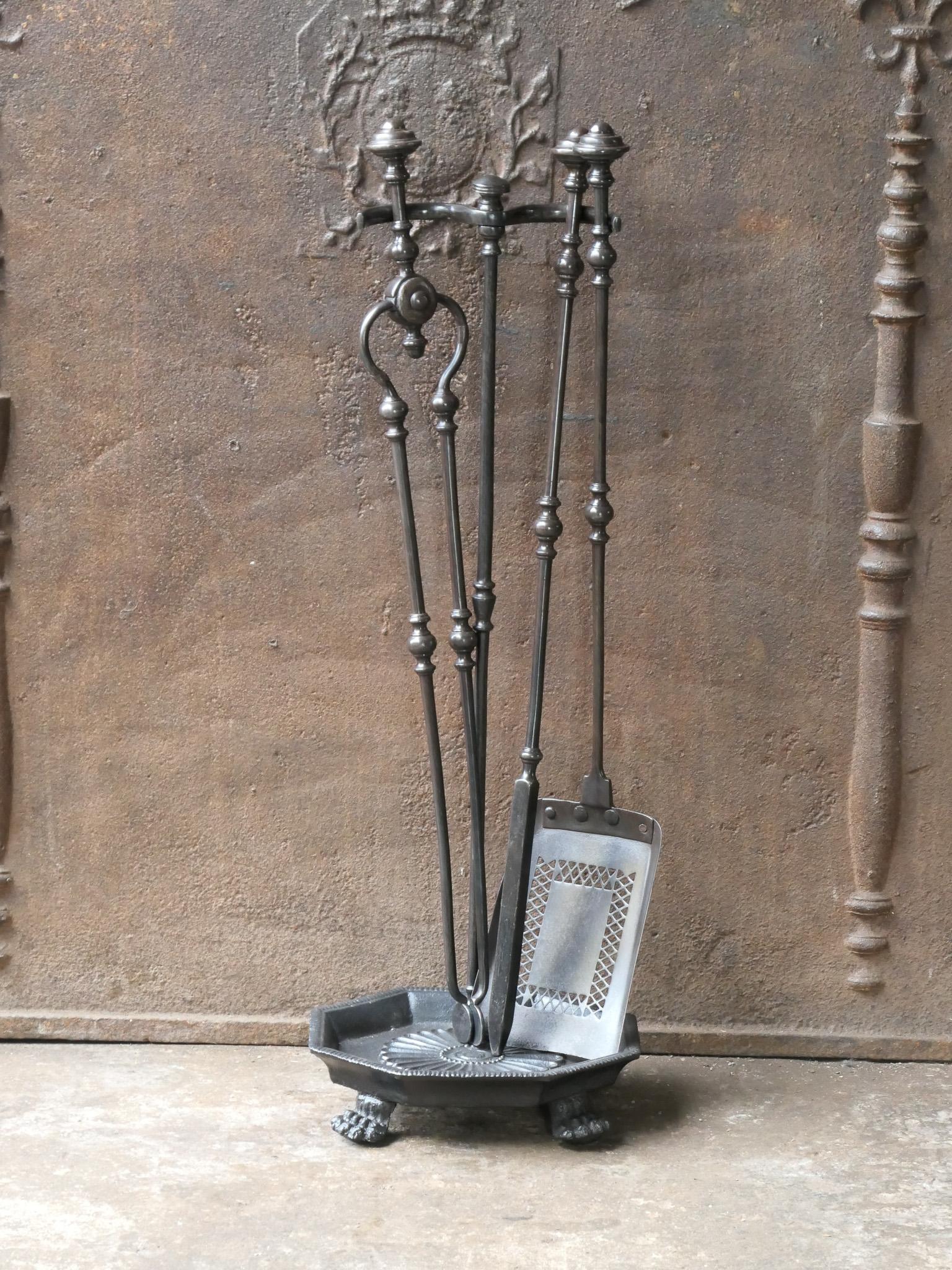 19th century English Victorian period fireplace toolset. The tools are made of wrought iron and the stand of cast iron. The toolset consists of tongs, shovel, poker and stand. The condition is good.








.