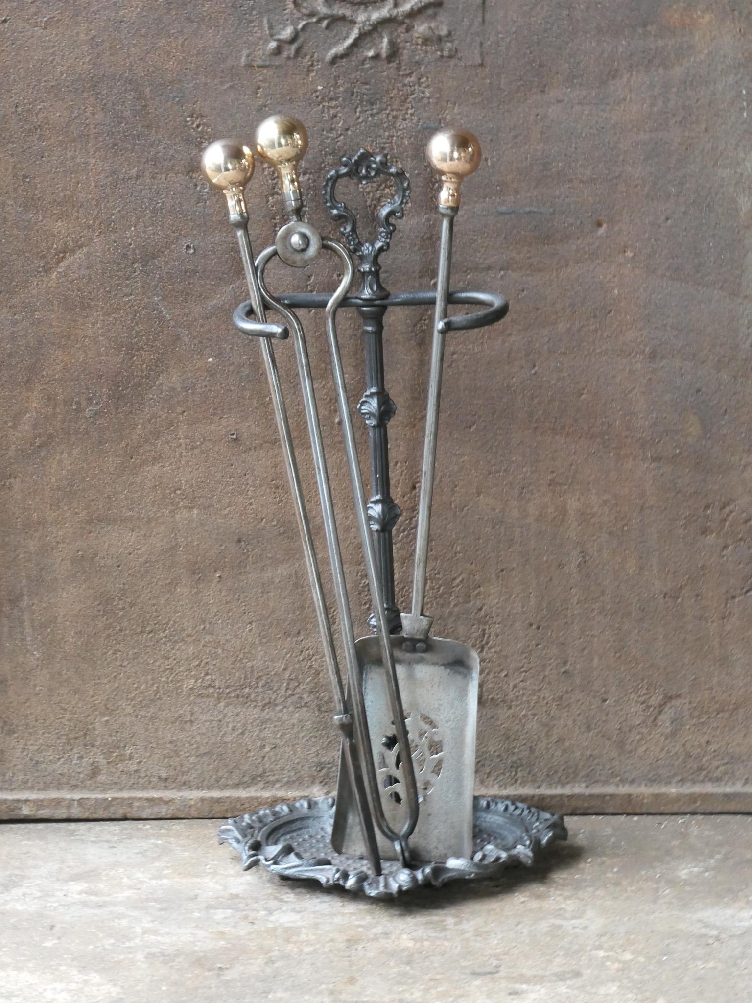 19th century English Victorian period fireplace toolset. The tools are made of wrought iron and copper and the stand of cast iron. The toolset consists of tongs, shovel, poker and stand. The condition is good.








.